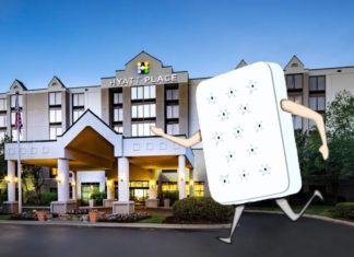 a cartoon character walking in front of a hotel