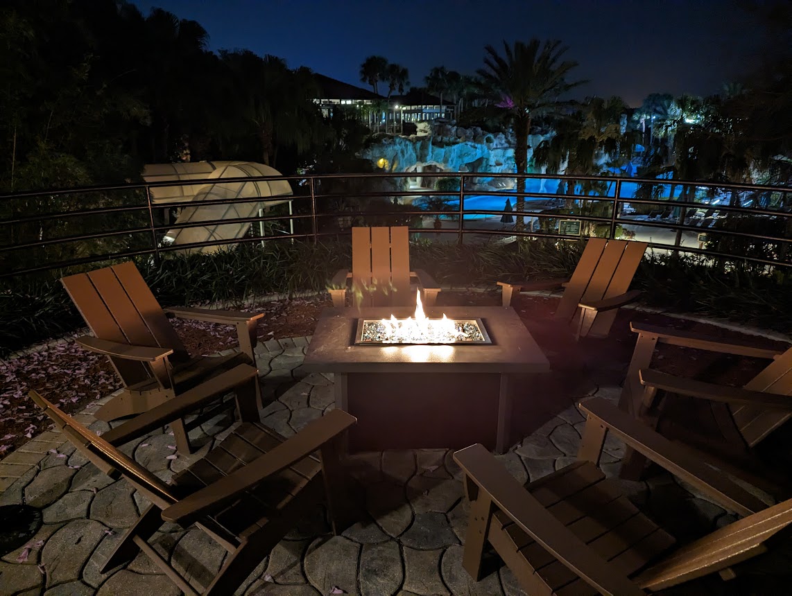 a fire pit with chairs around it
