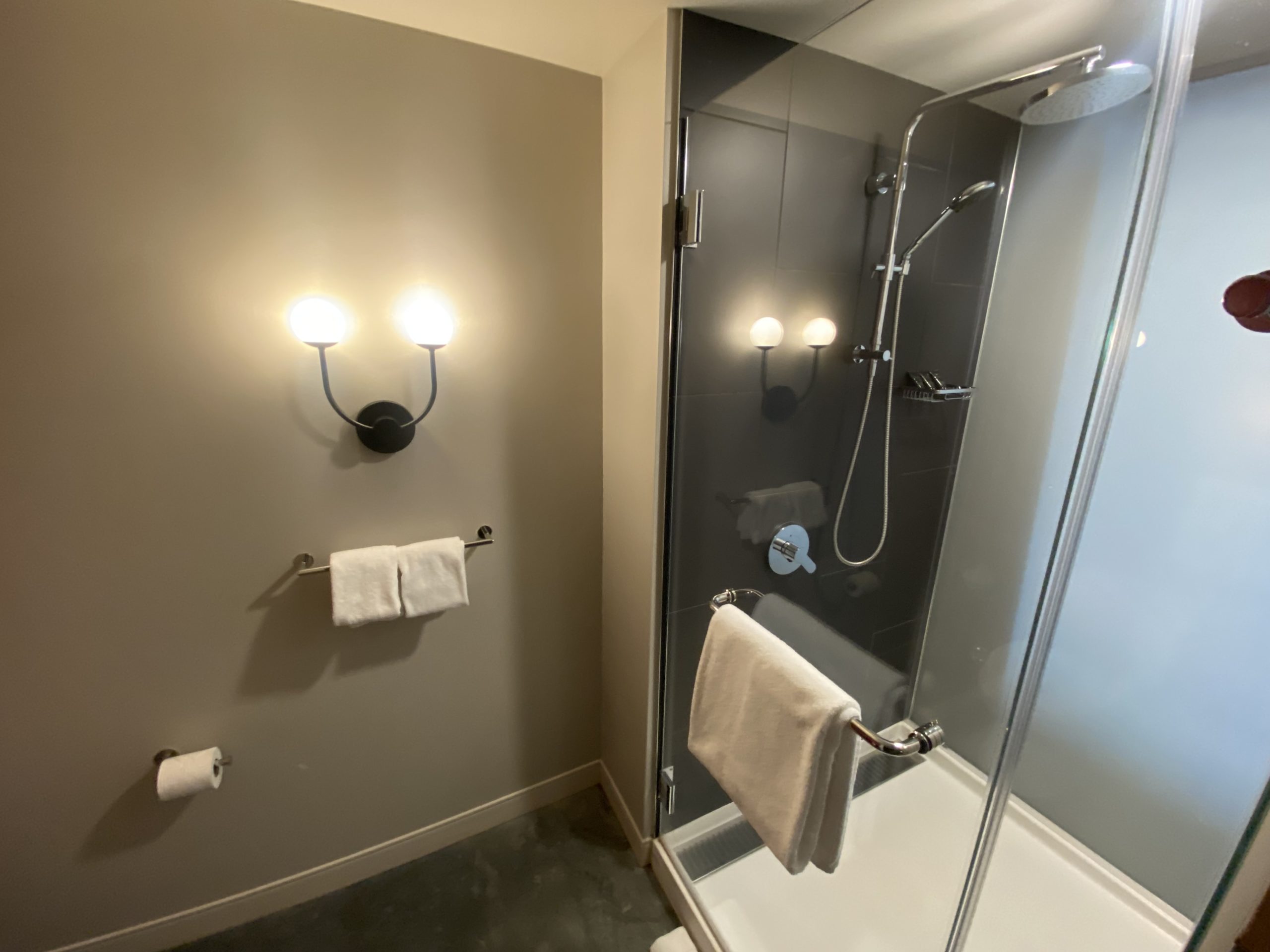 a bathroom with a shower and a shower head
