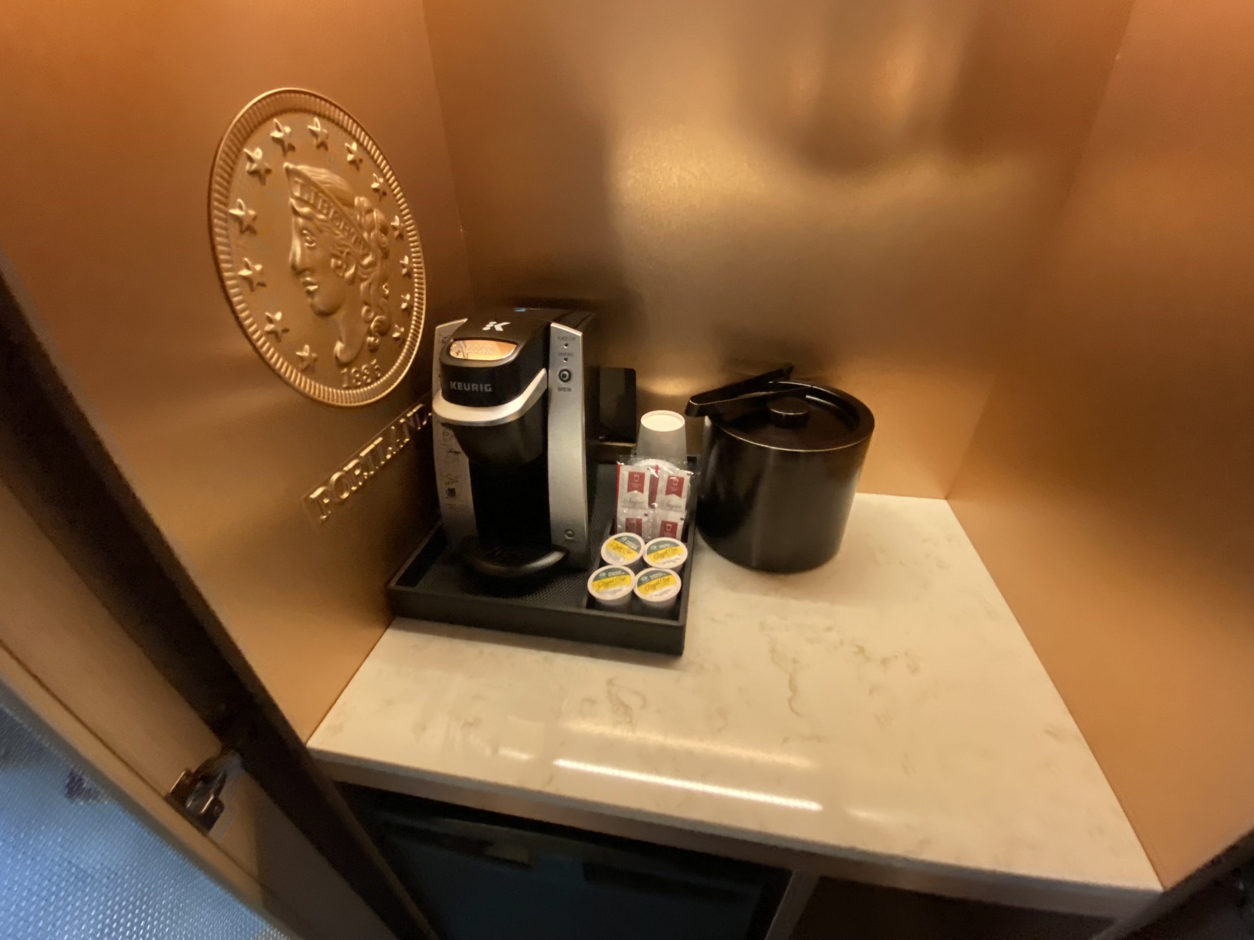 a coffee machine and coffee pot on a counter