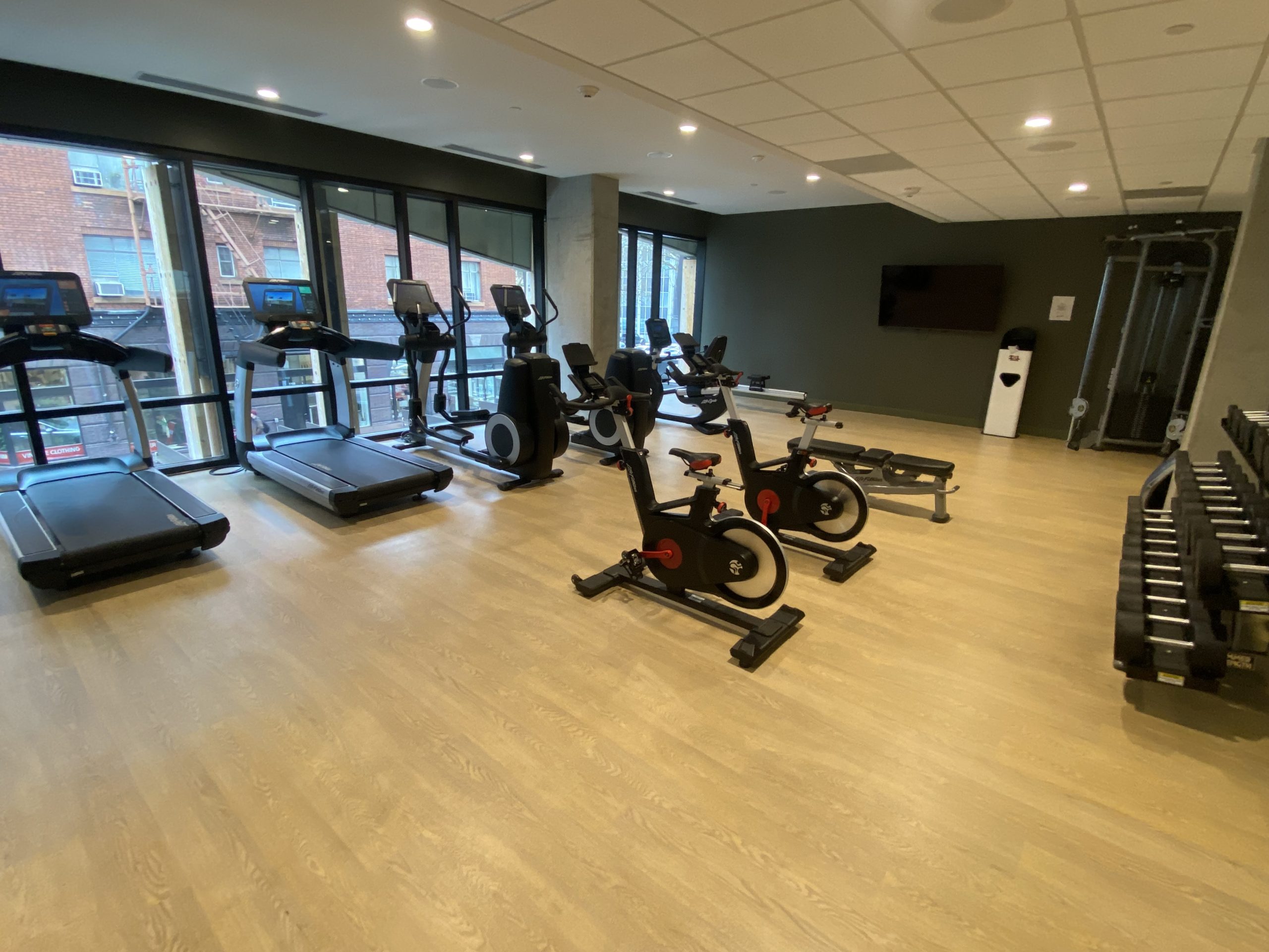 a room with exercise bikes and treadmills