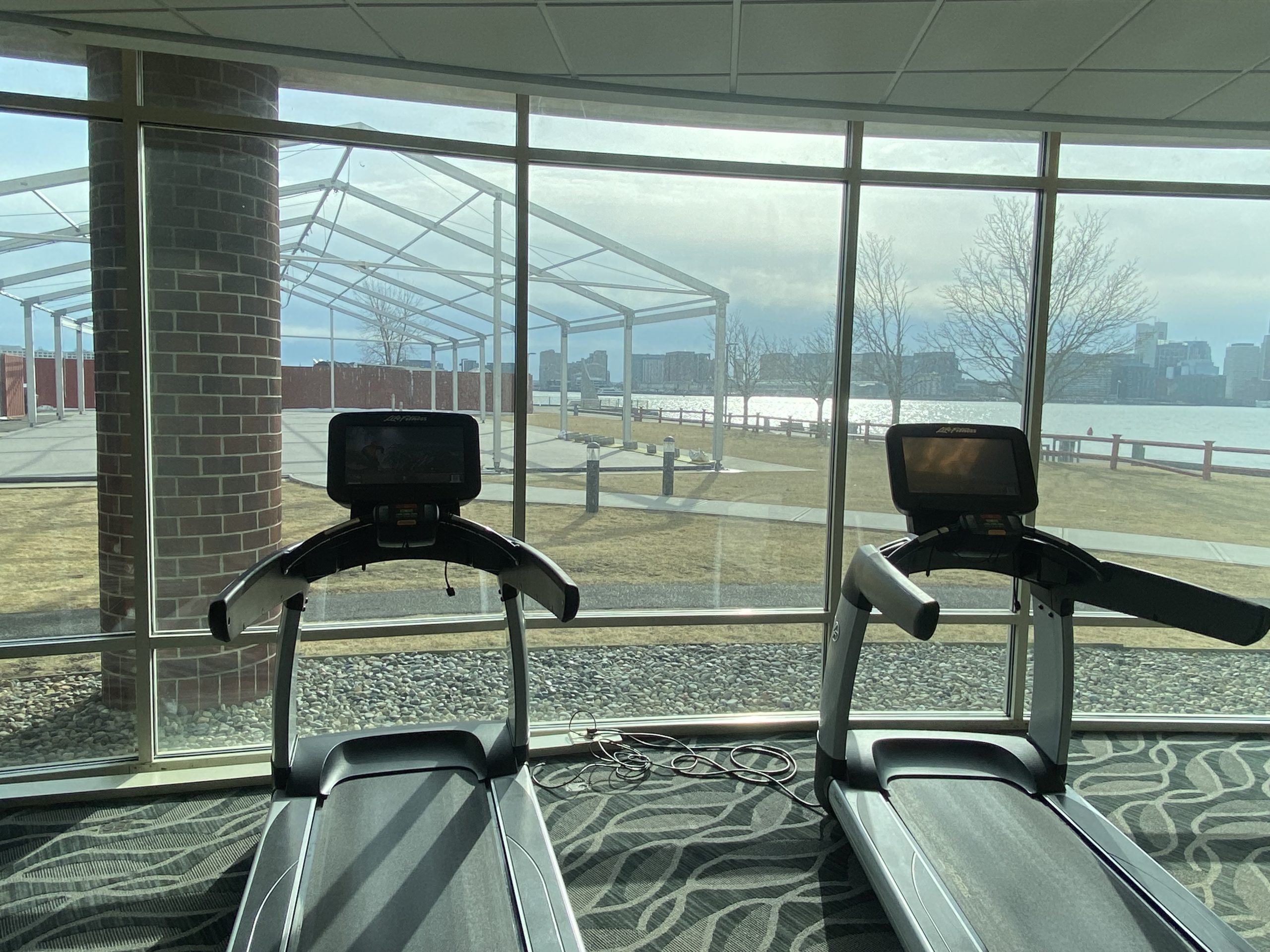 tread treadmills in a room with a large window