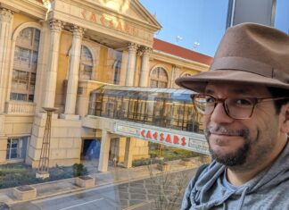 a man wearing a hat and glasses