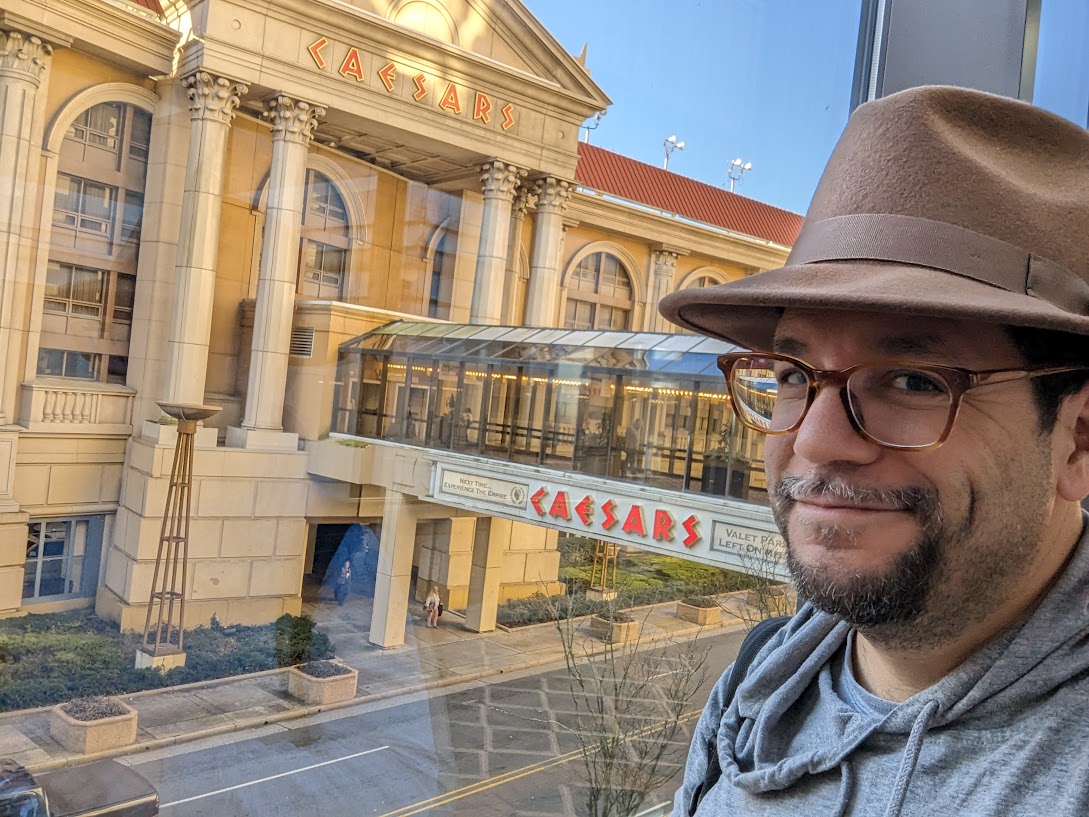 a man wearing a hat and glasses