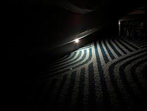 a light shining on a carpet