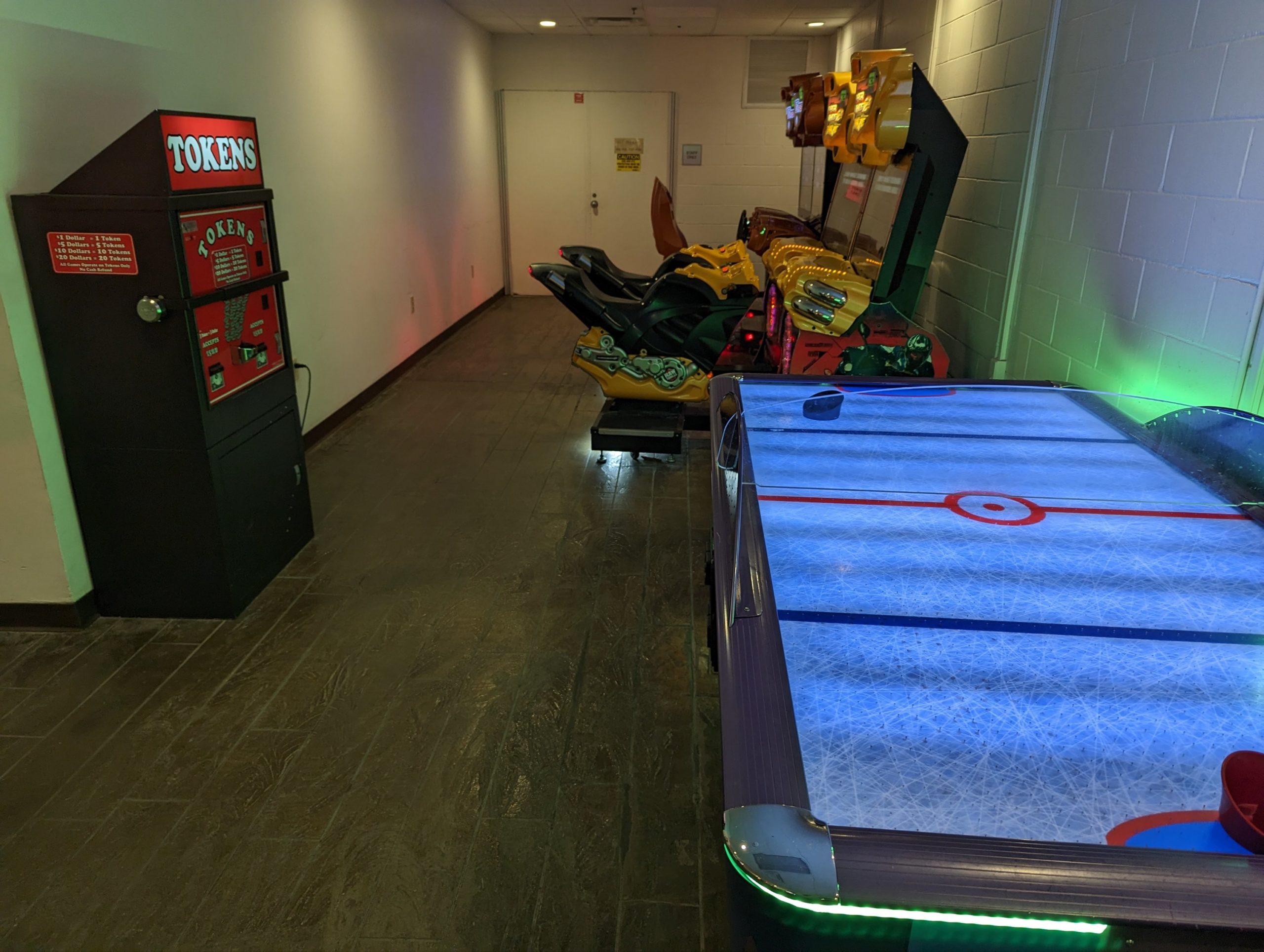 a game room with arcade games and arcade machines