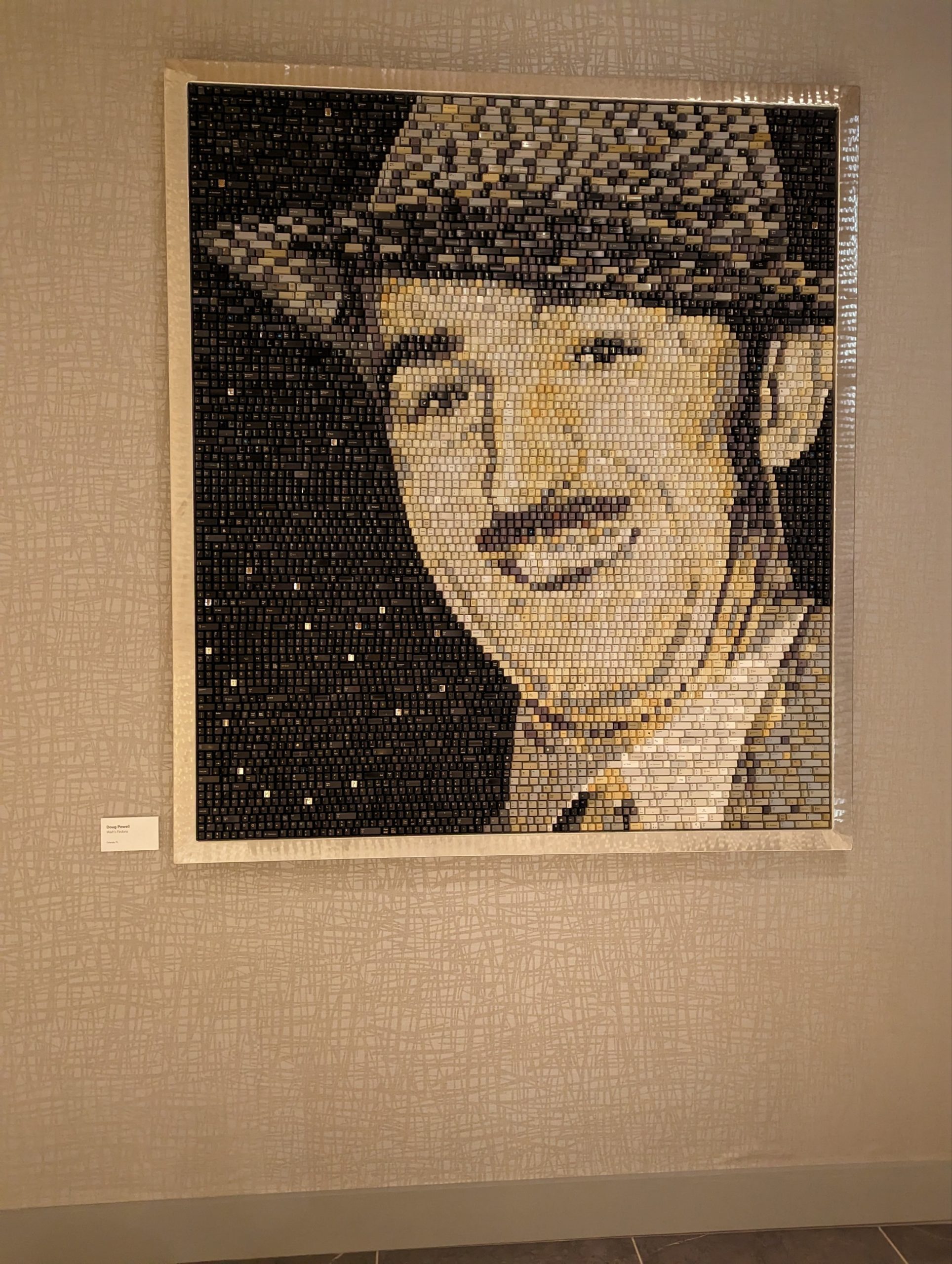 a man in a hat on a wall