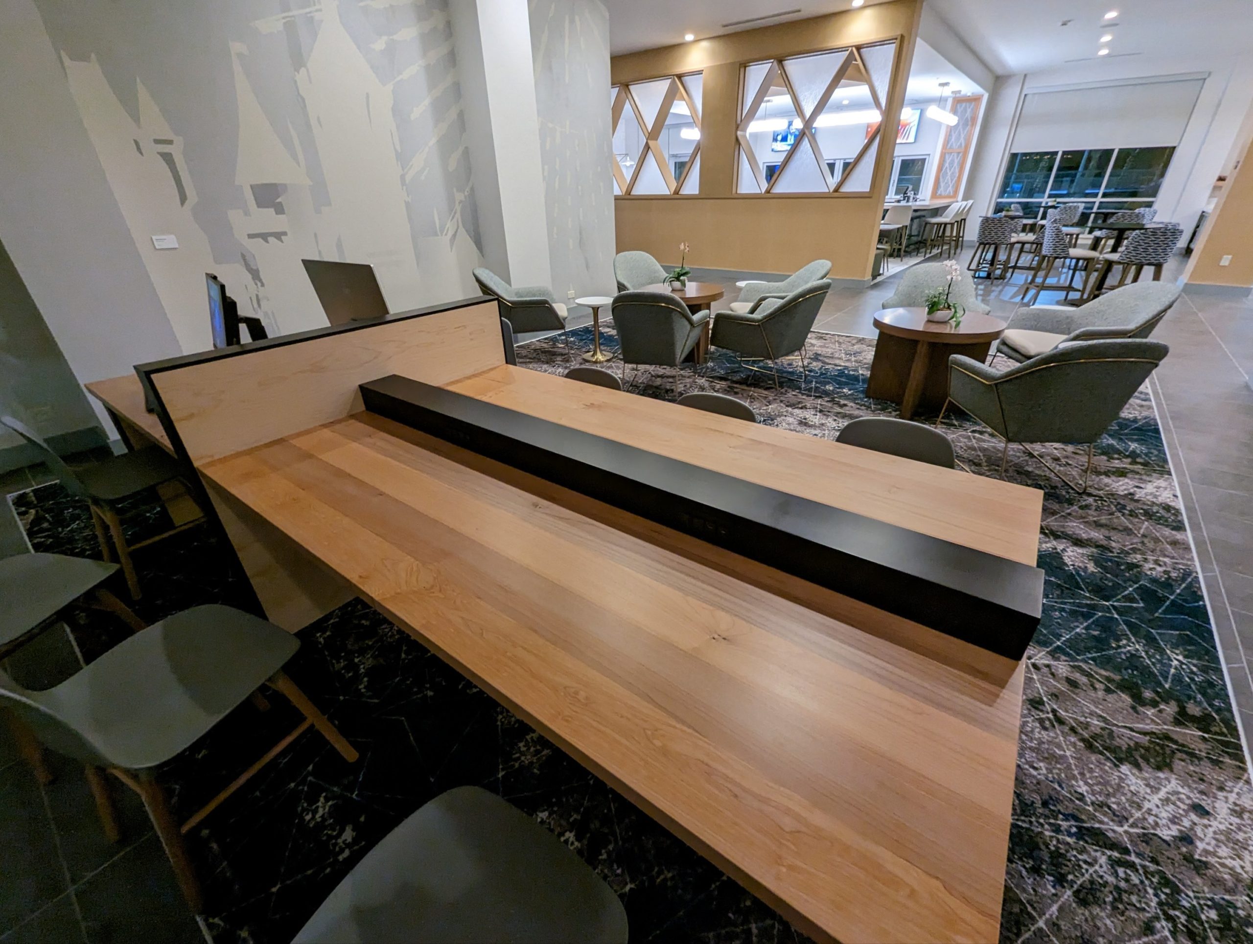 a long wooden table with a long rectangular object on it