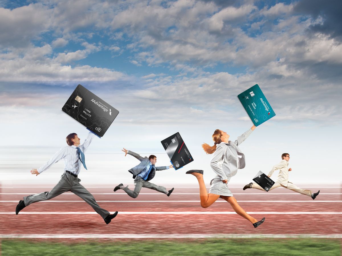 a group of people running with credit cards