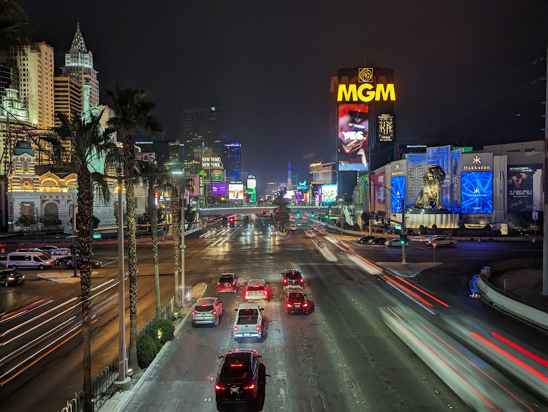 a city street with cars and buildings