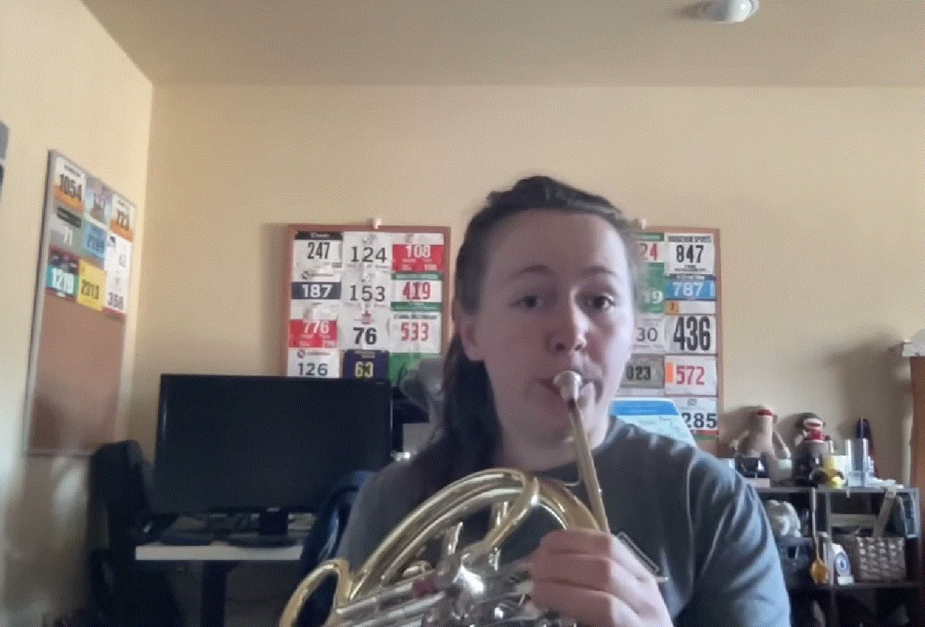 a person playing a french horn