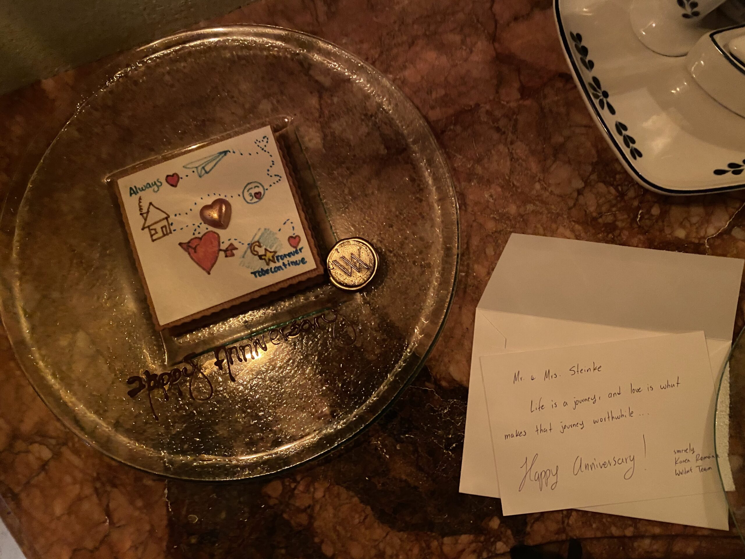 a plate with a picture on it and a coin on it