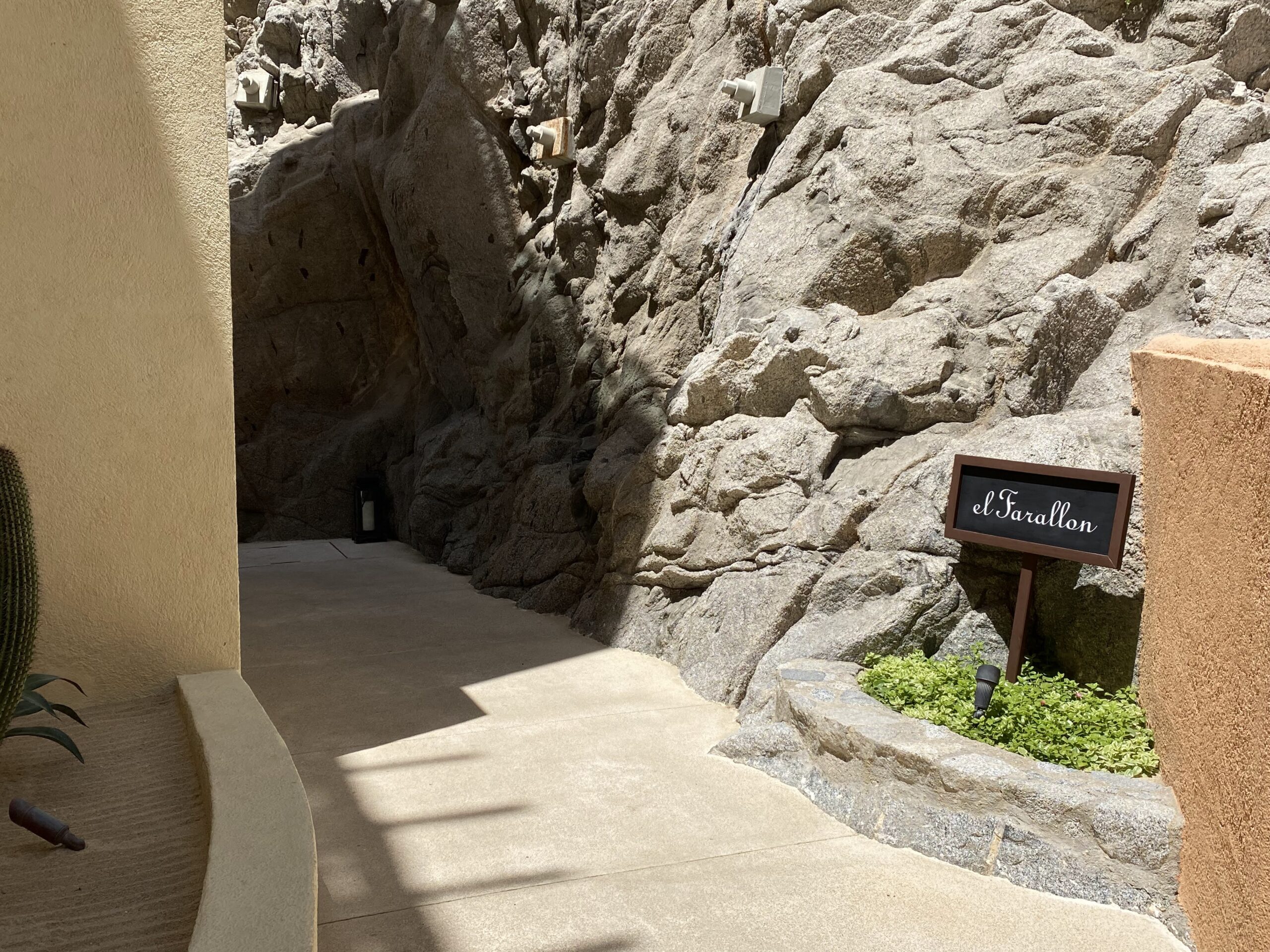 a sign in a rock wall