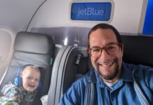 a man and child in an airplane