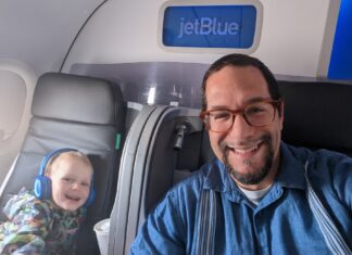 a man and child in an airplane