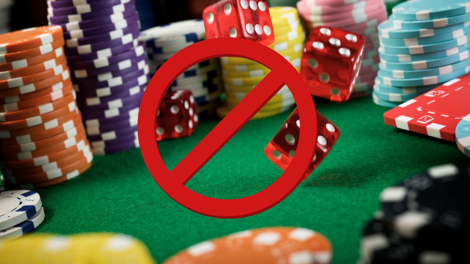 a red circle with dice on top of a casino table