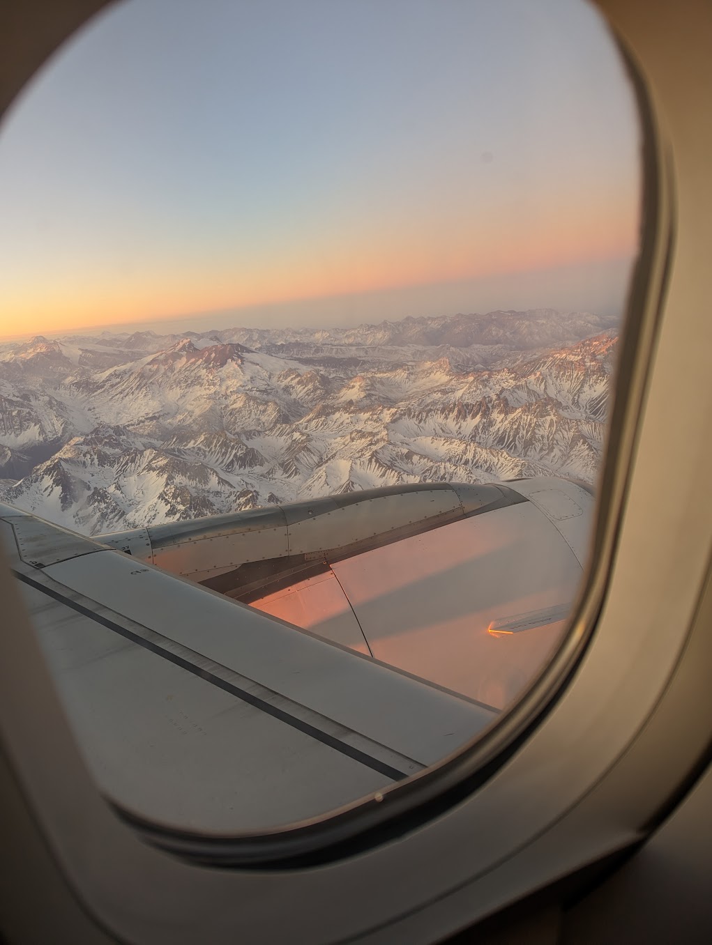 a view of mountains from an airplane window