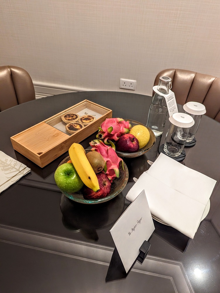 a table with fruit and a tray of food