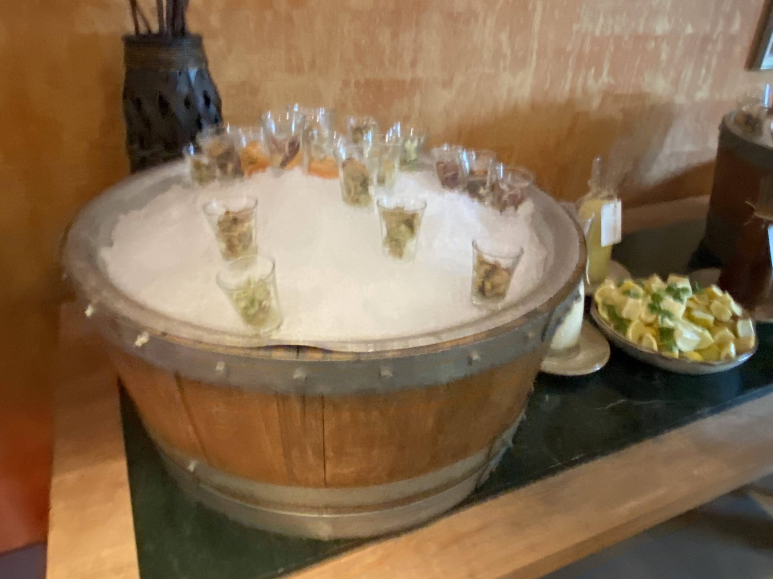 a wooden barrel with ice on top of it