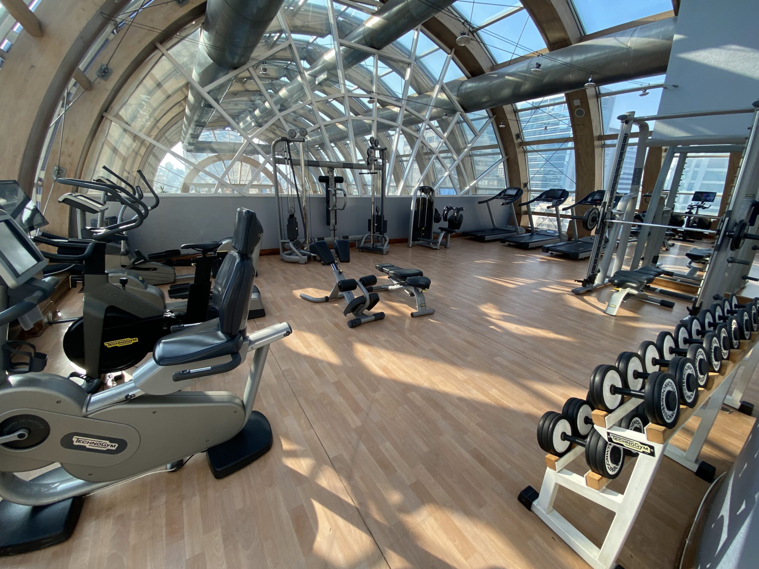 a large gym with many exercise equipment
