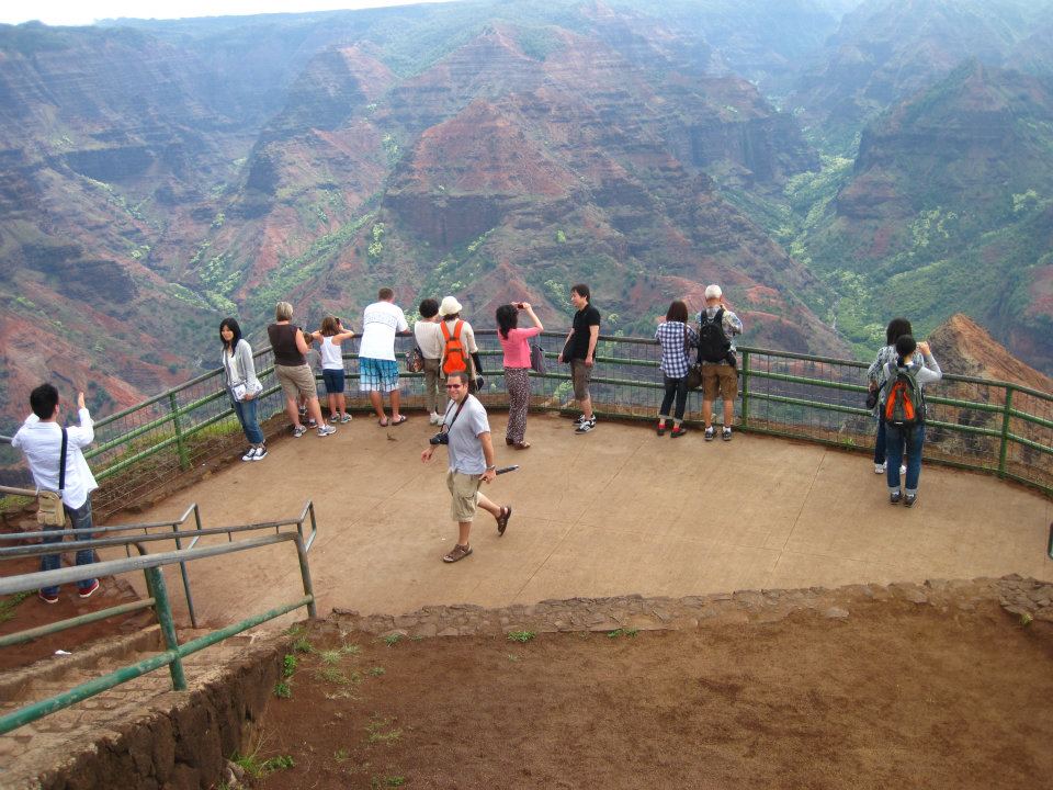 a group of people standing on a lookout