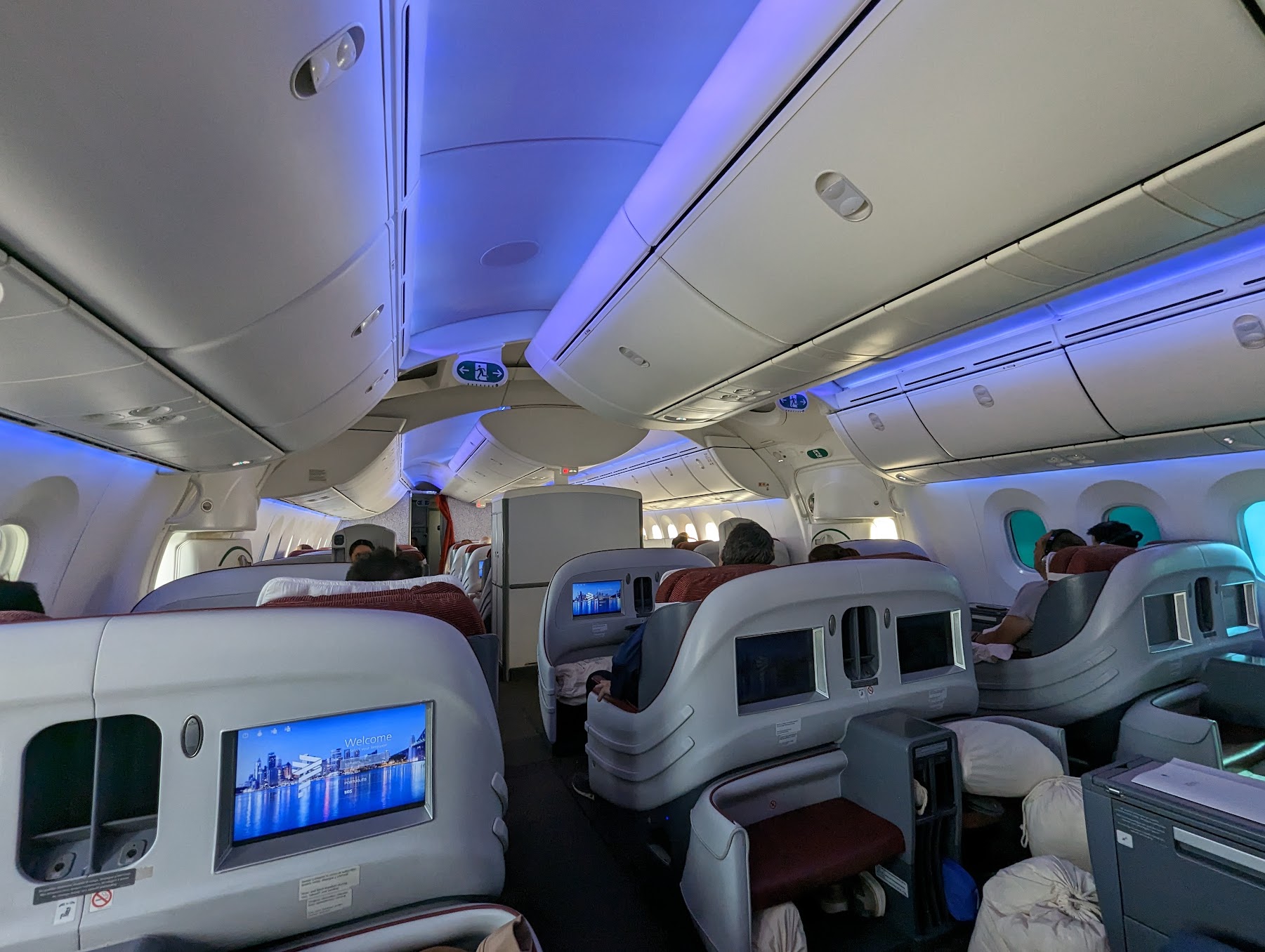 a plane with seats and a television