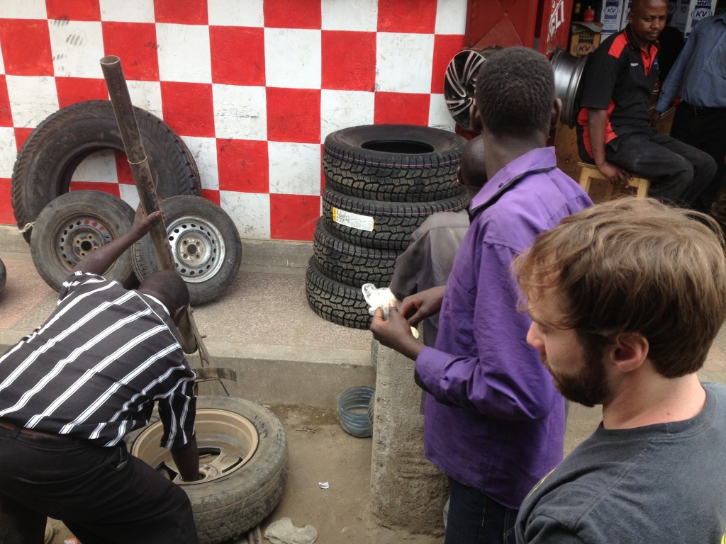 Fixing a tire outside of Masai Mara