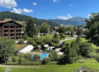 a resort with a pool and trees