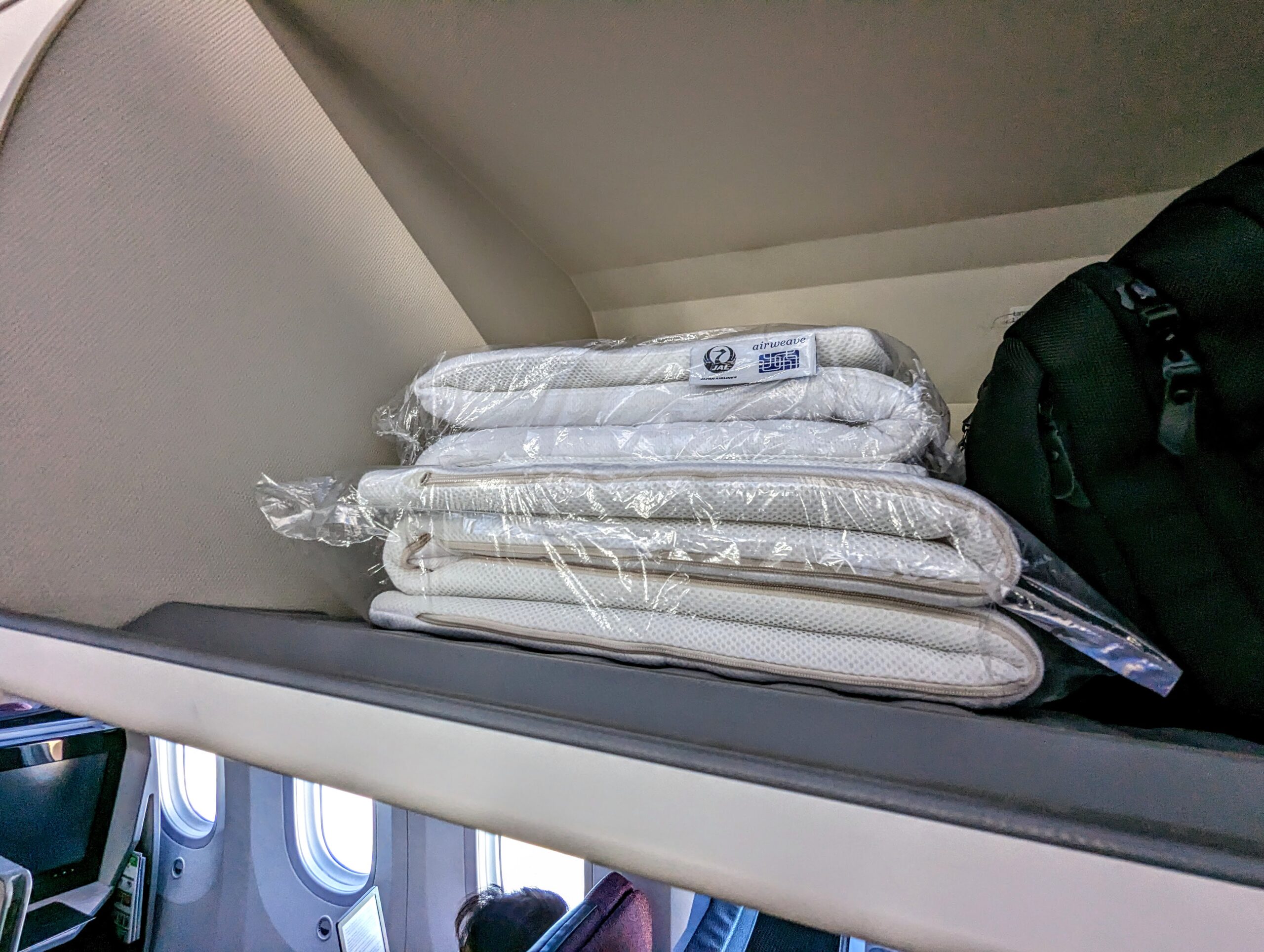 a stack of white towels on a shelf