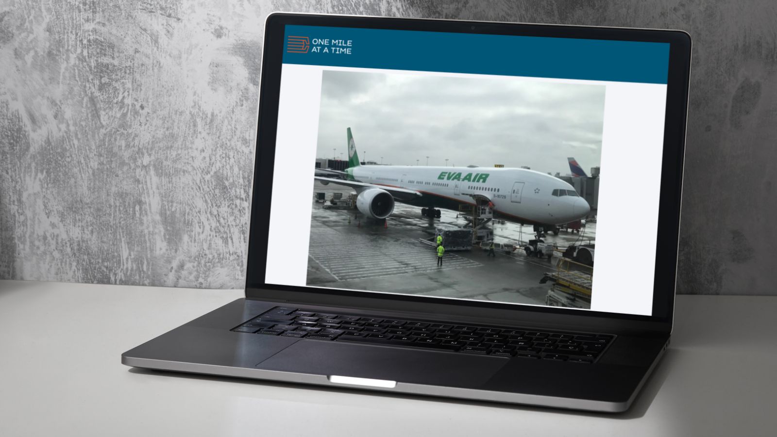a laptop with a picture of an airplane on the screen