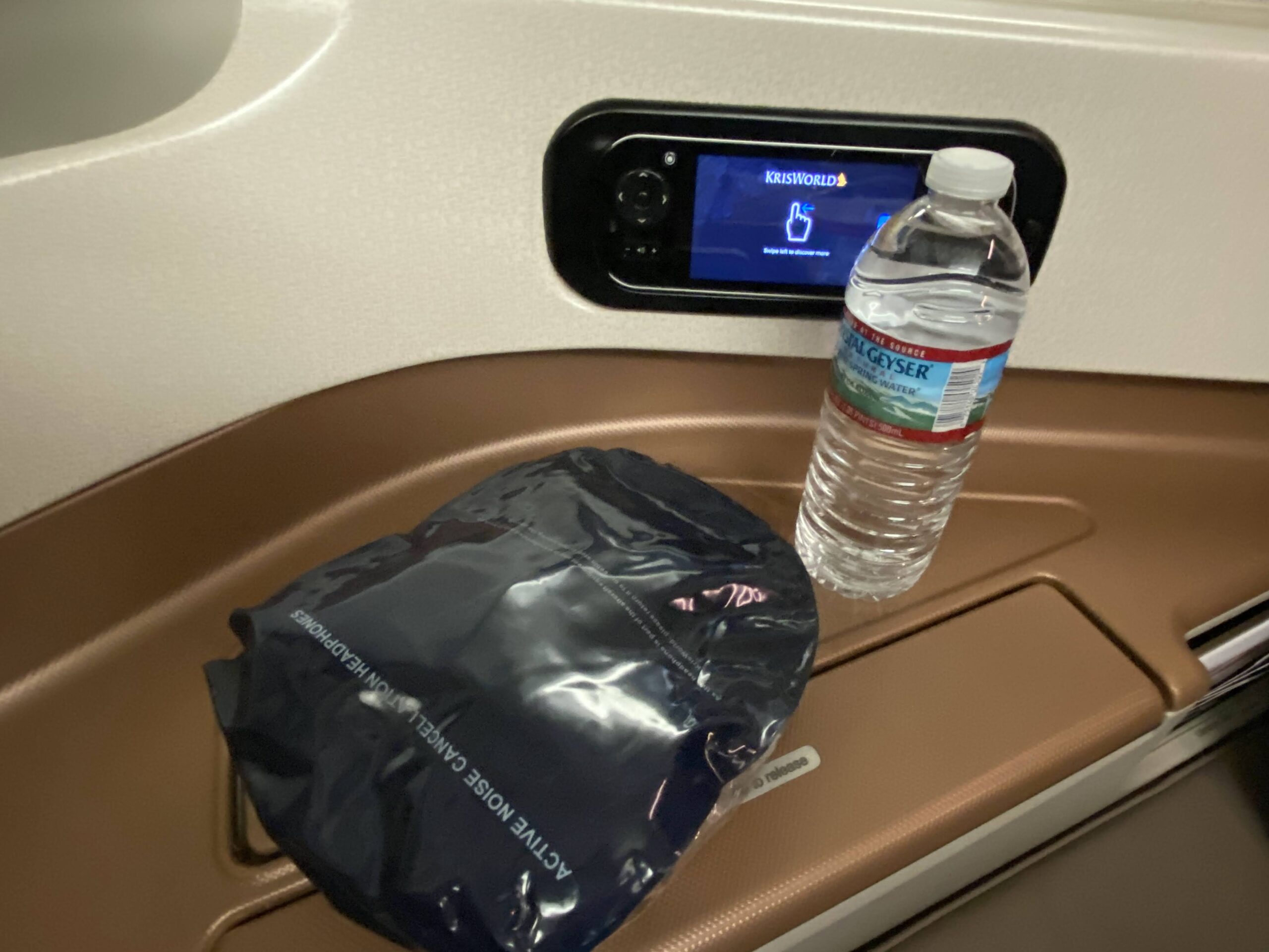 a plastic bag and a bottle of water on a table