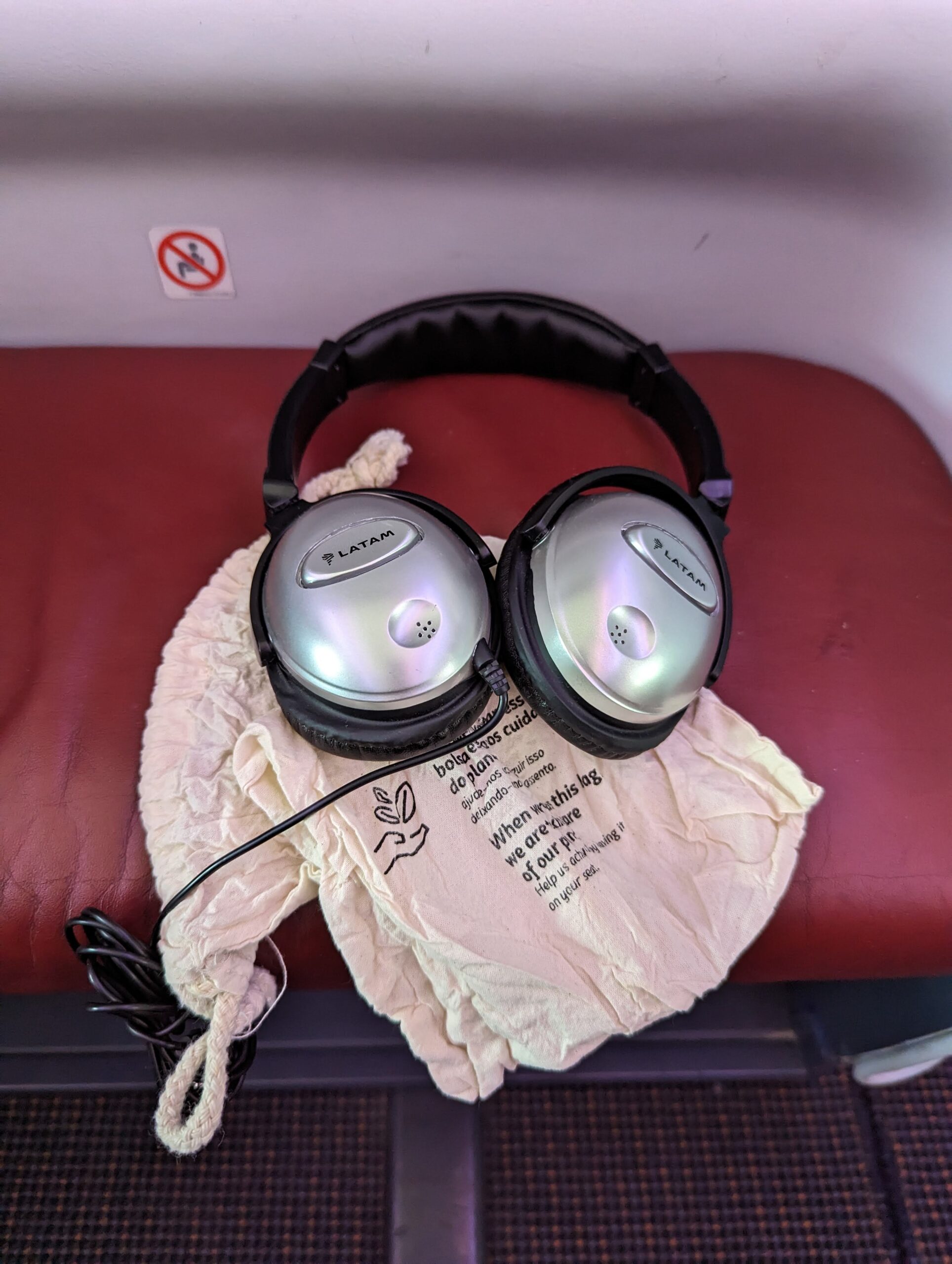 a pair of headphones on a white cloth