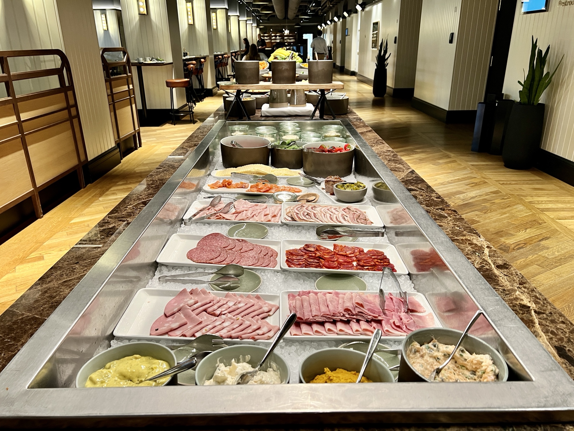 a buffet line with different types of food on it