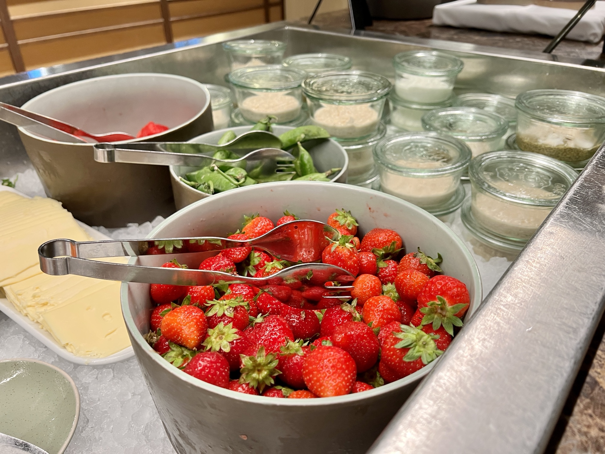 a bowl of strawberries and other food items