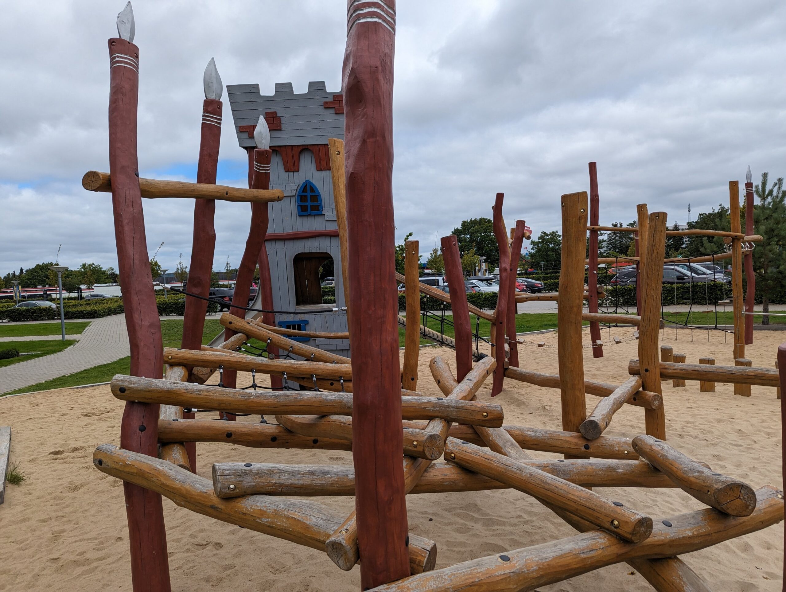 a wooden structure in a playground