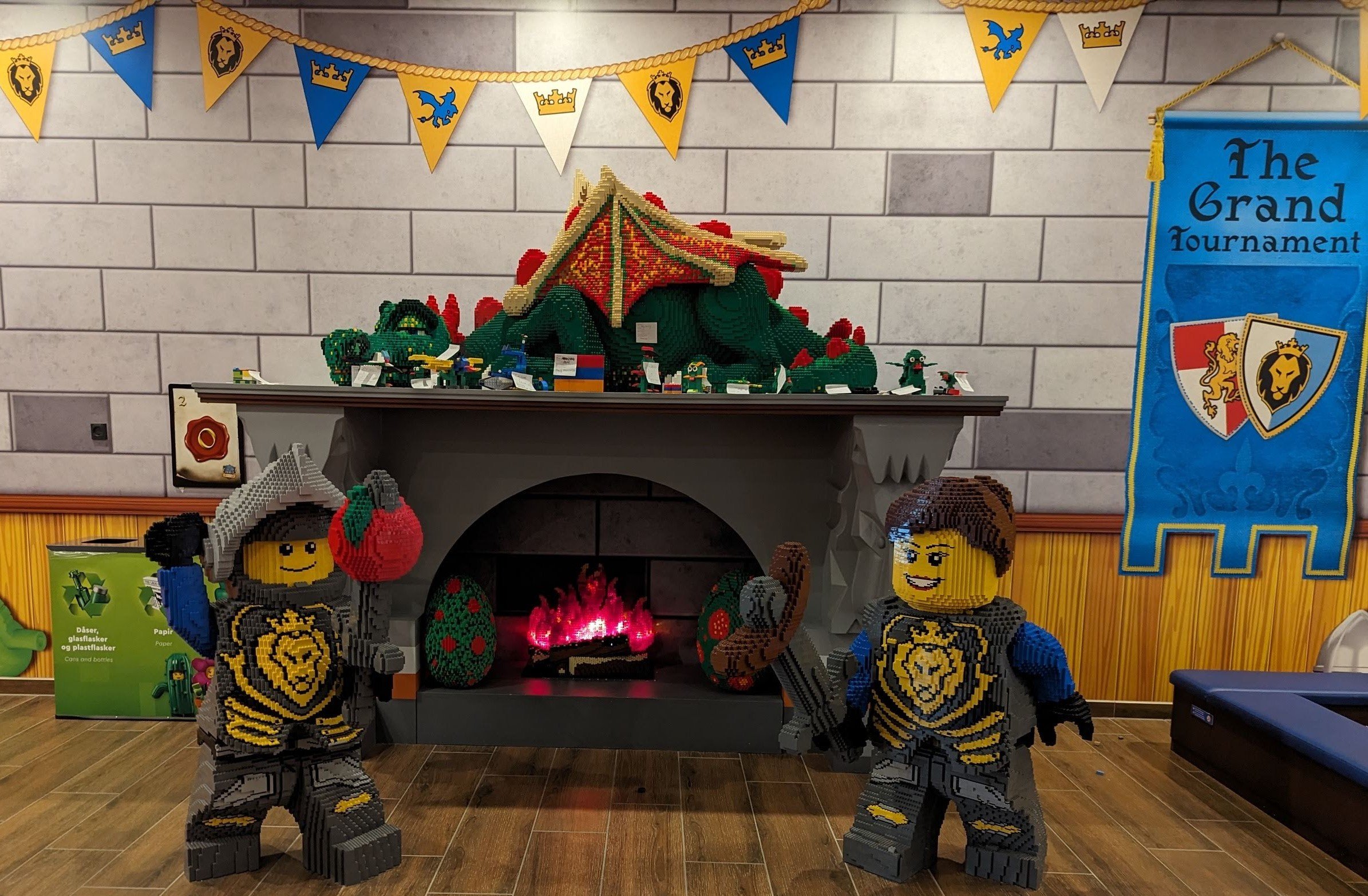 a group of lego figures next to a fireplace