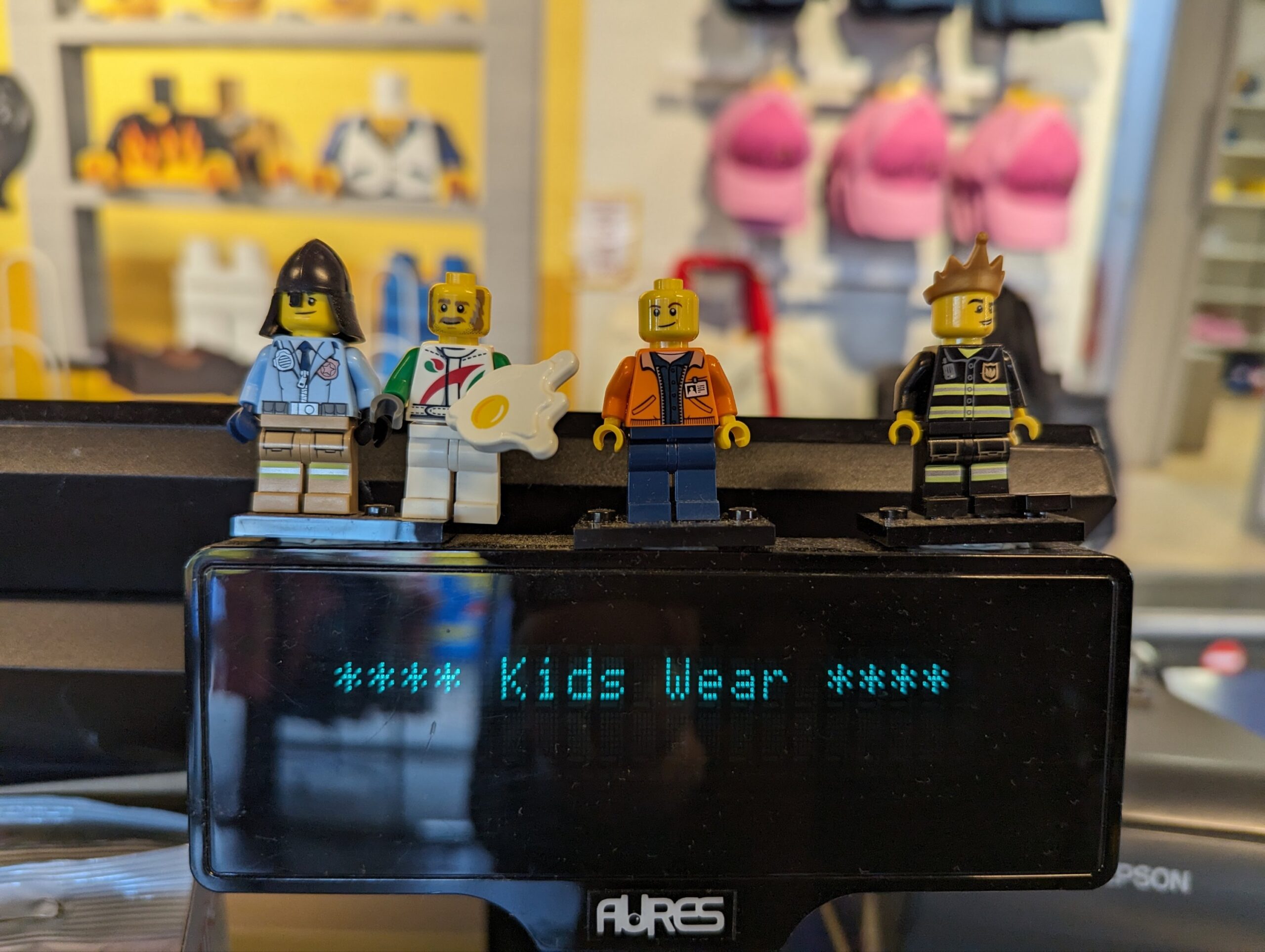 a group of lego figures on a display