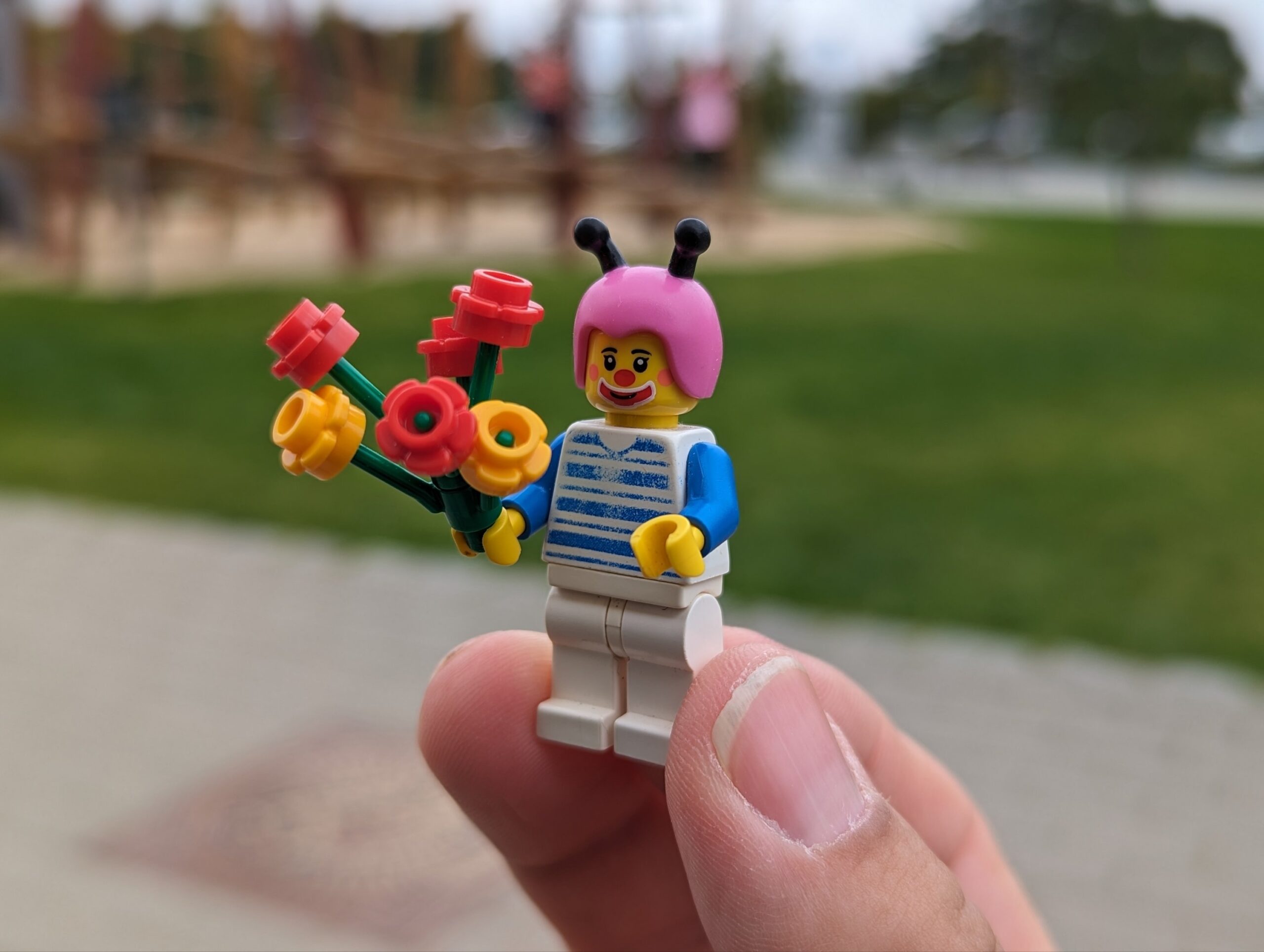 a person holding a lego figure