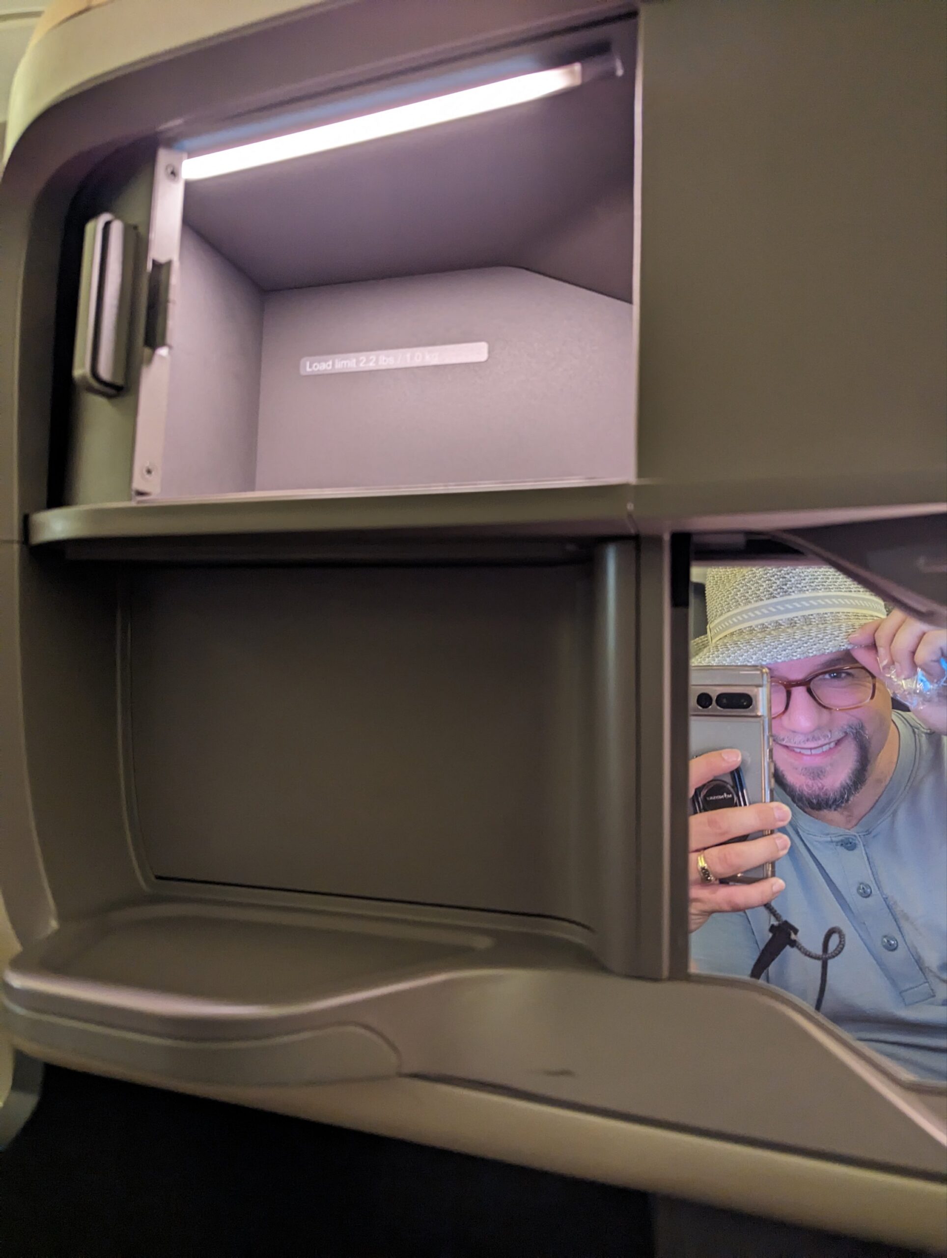 a man taking a selfie in an open safe