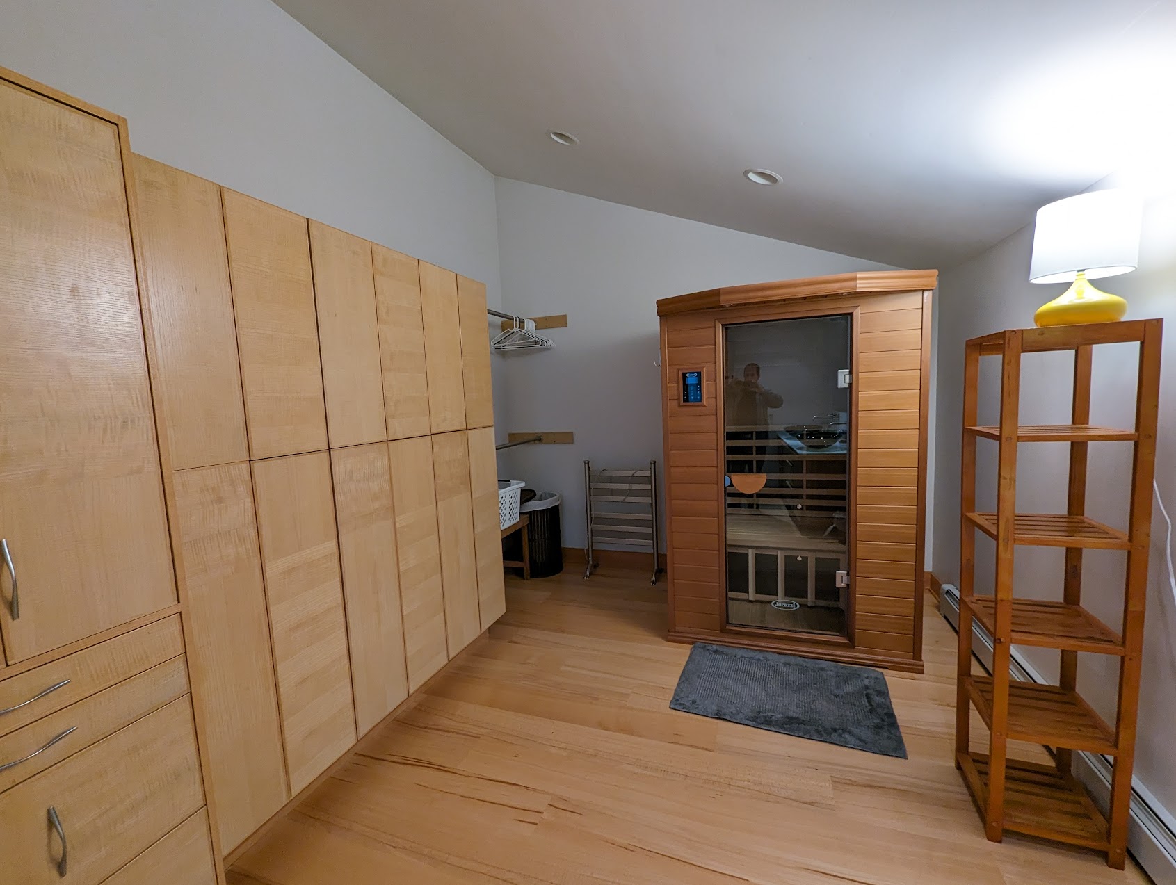 a room with a sauna and shelves