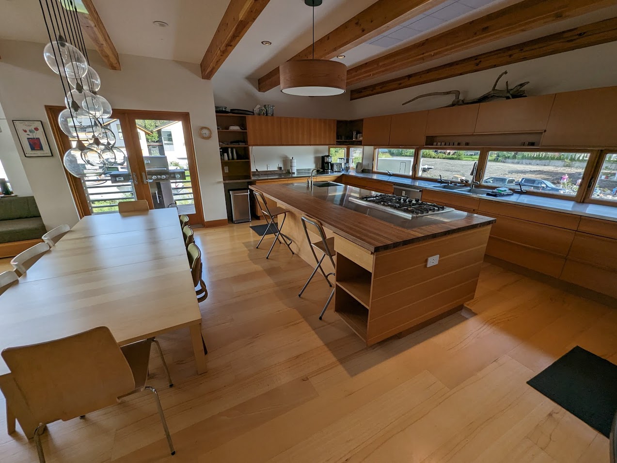 a kitchen with a large island and a large table