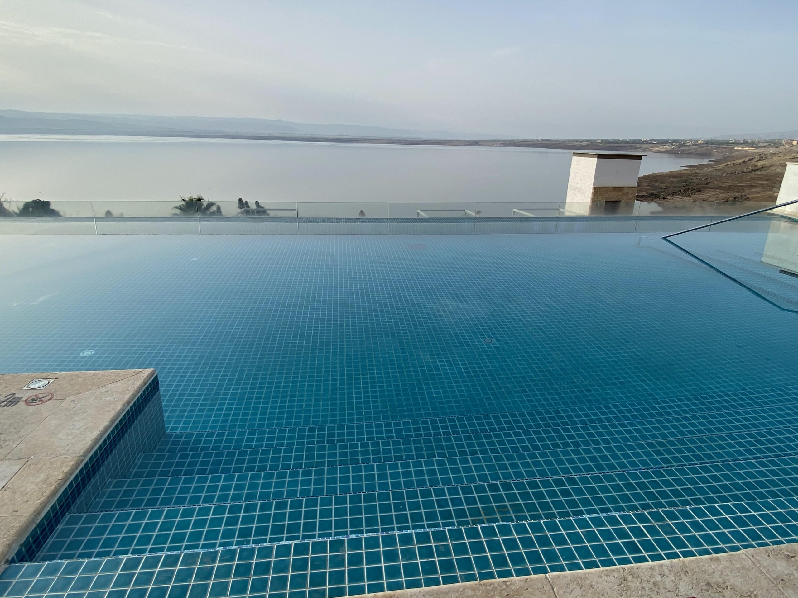 a pool with a view of the water