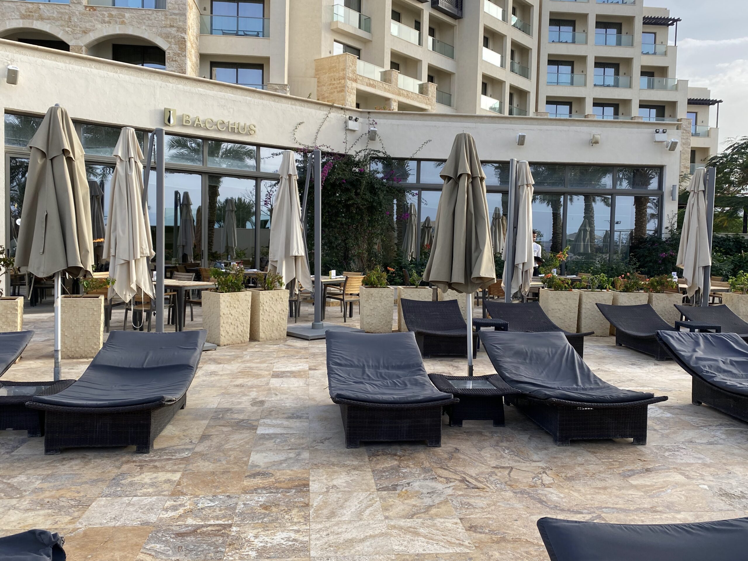 a lounge chairs outside of a hotel