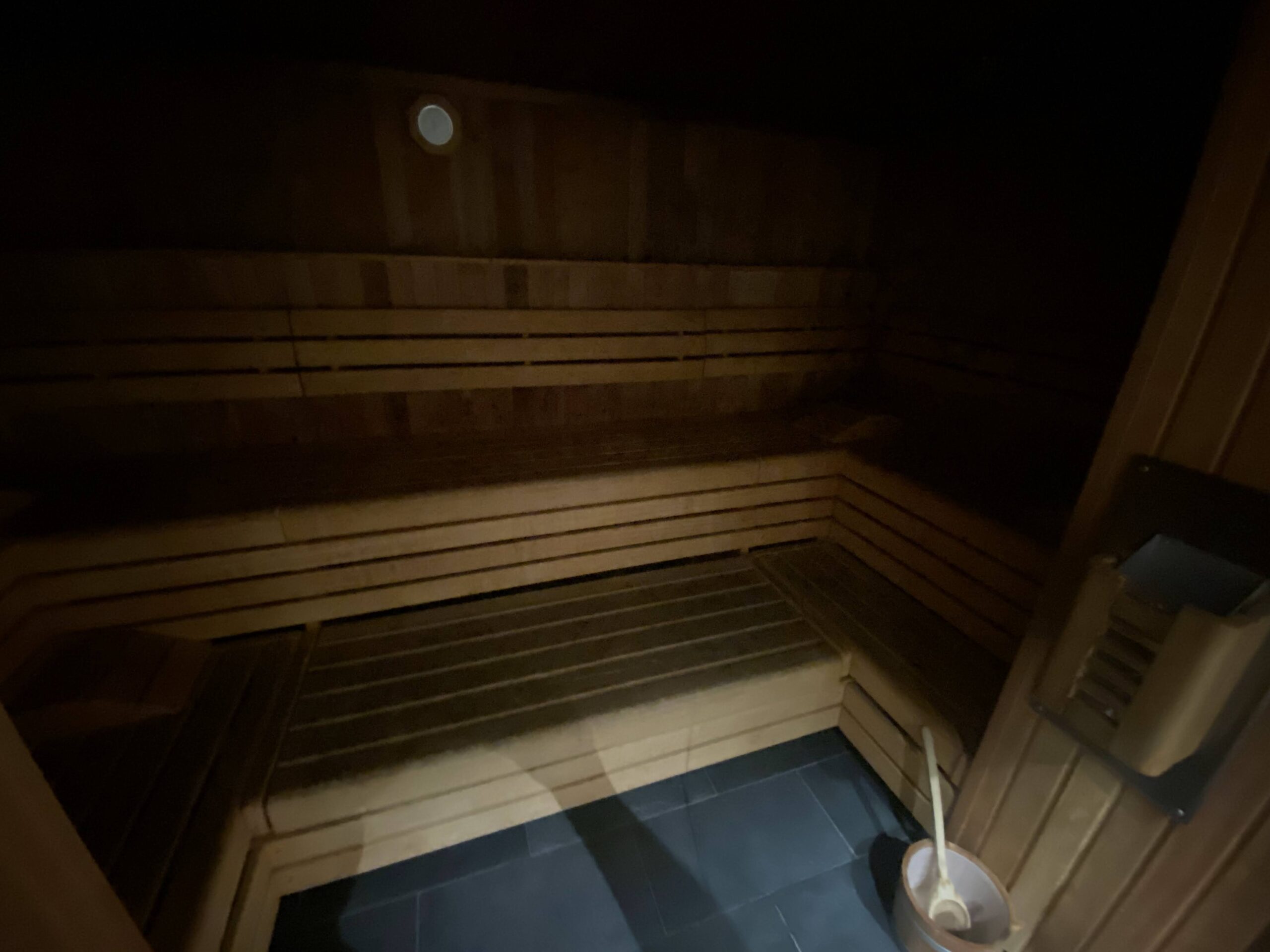 a wooden sauna with a spoon in it