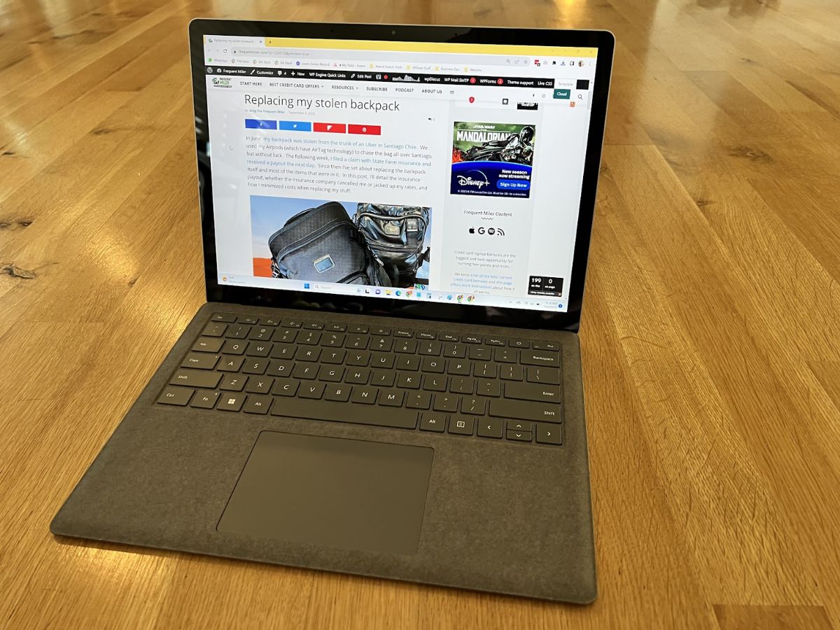 a laptop on a wooden surface