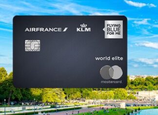 a credit card with a park and people in the background