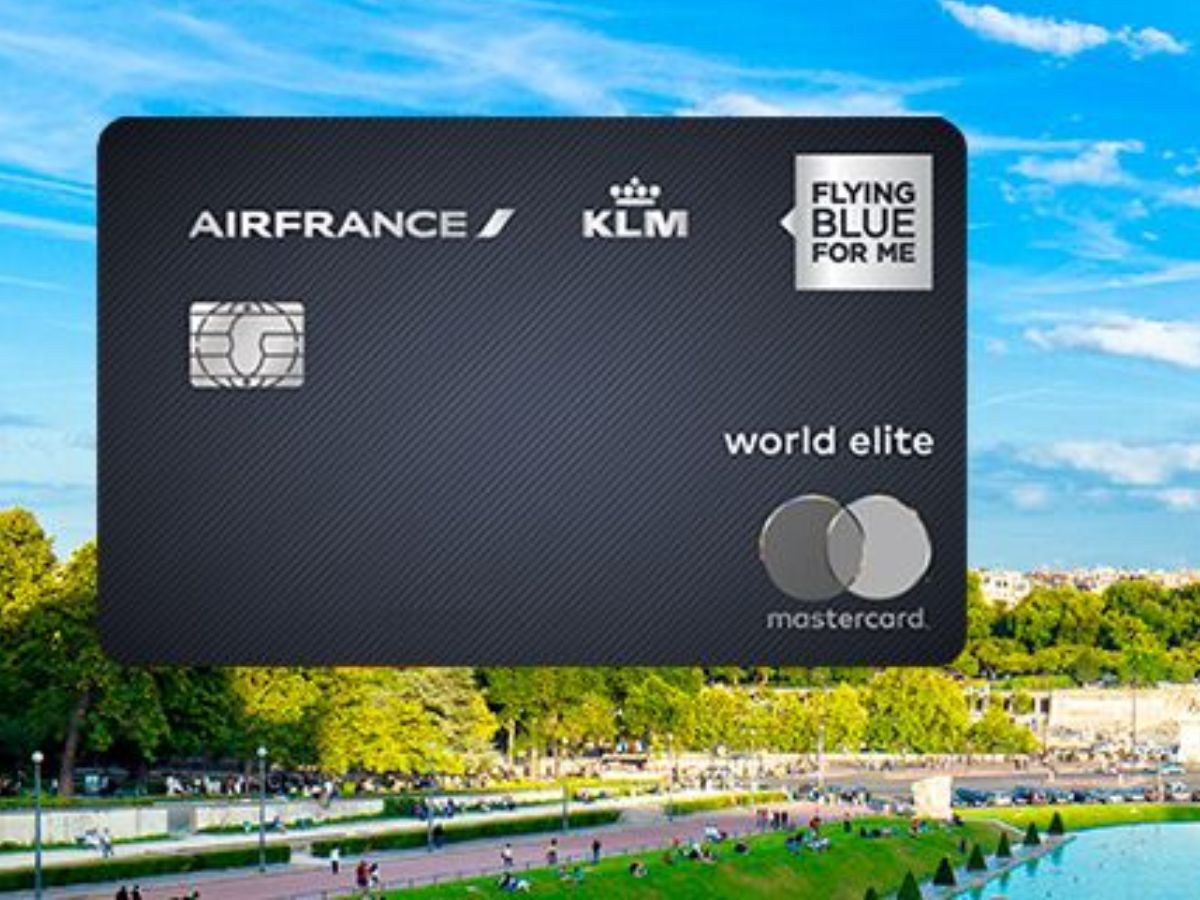 a credit card with a park and people in the background