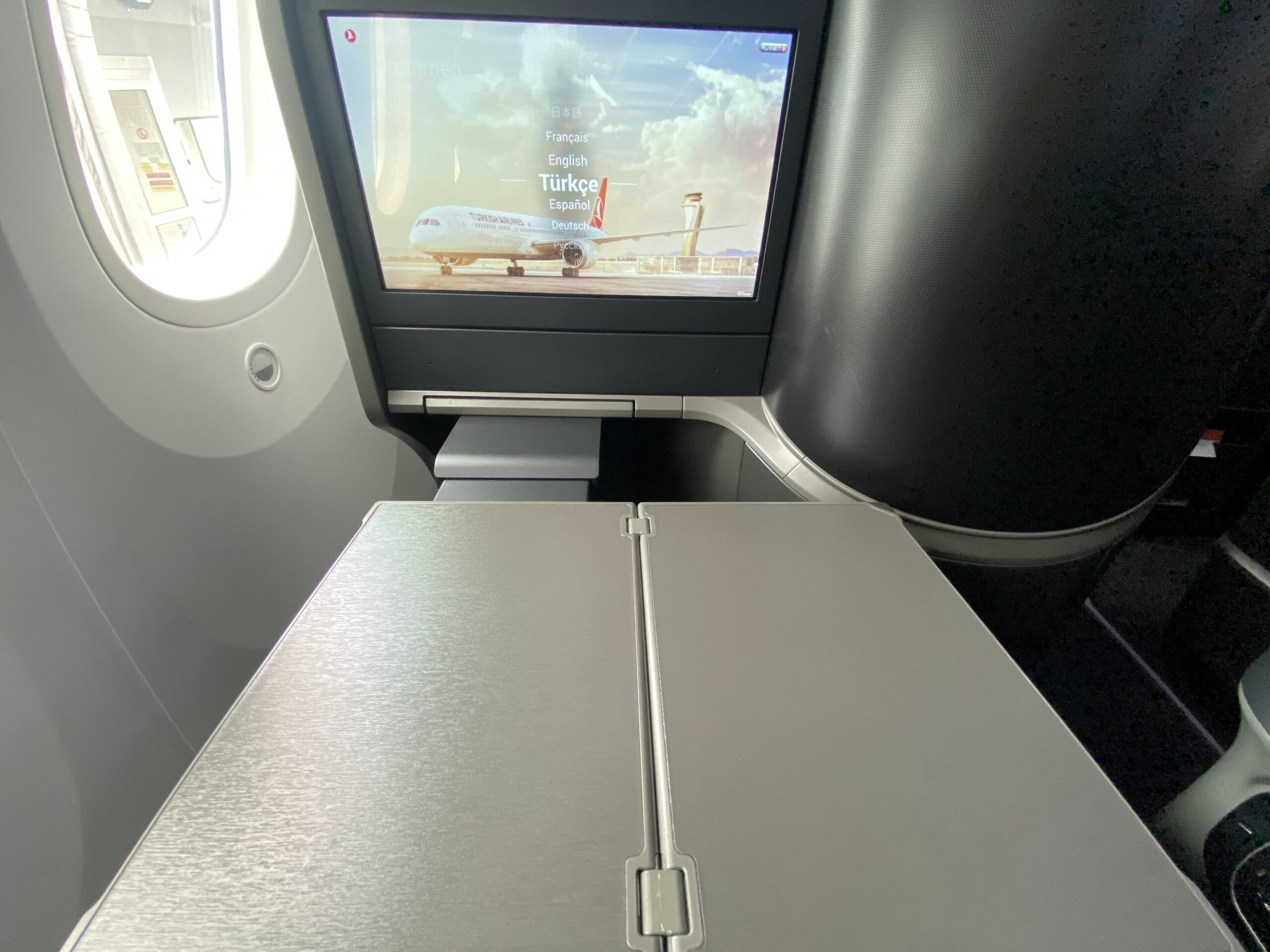 a tv on the side of an airplane