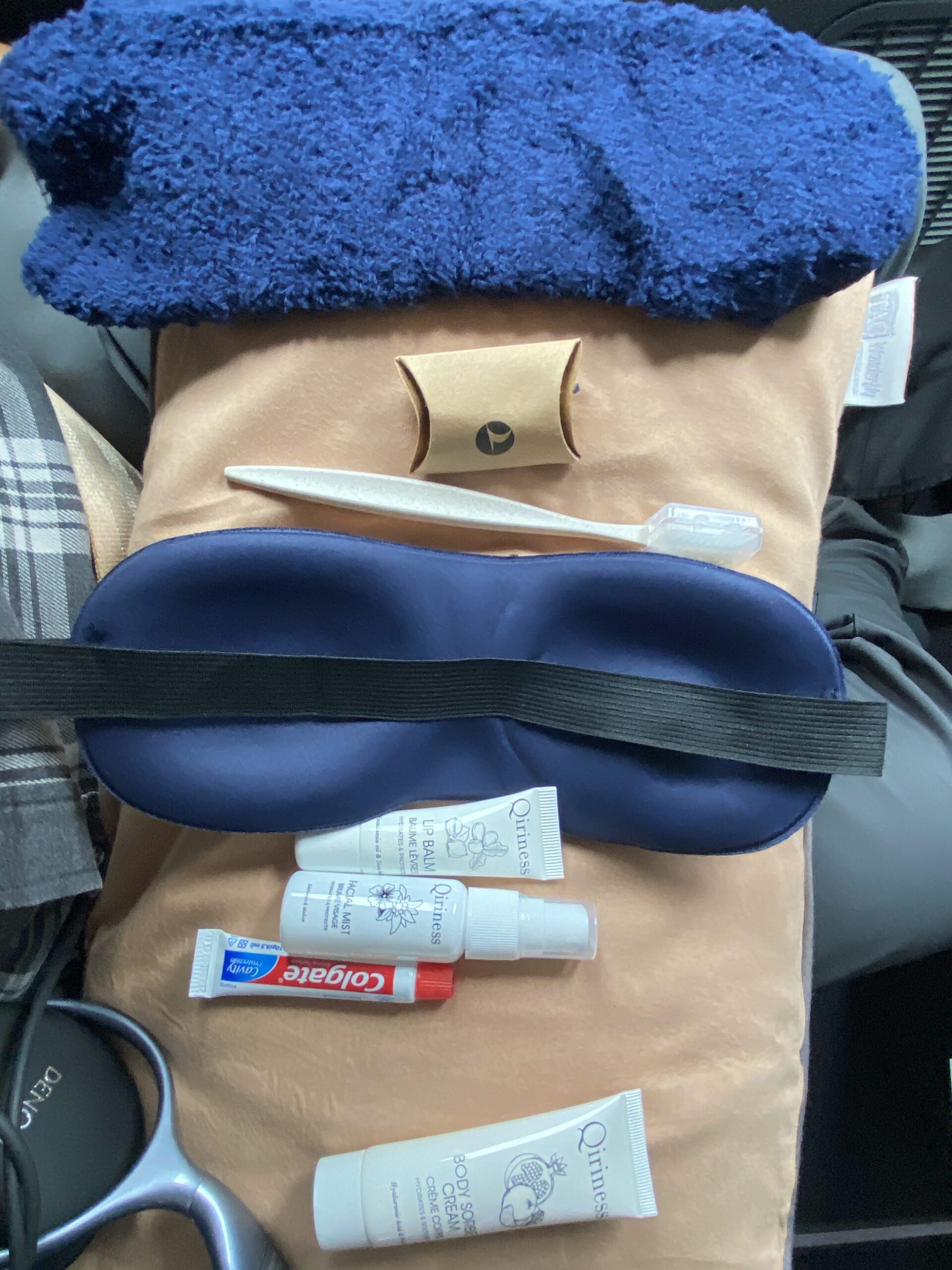 a sleeping mask and other items on a pillow