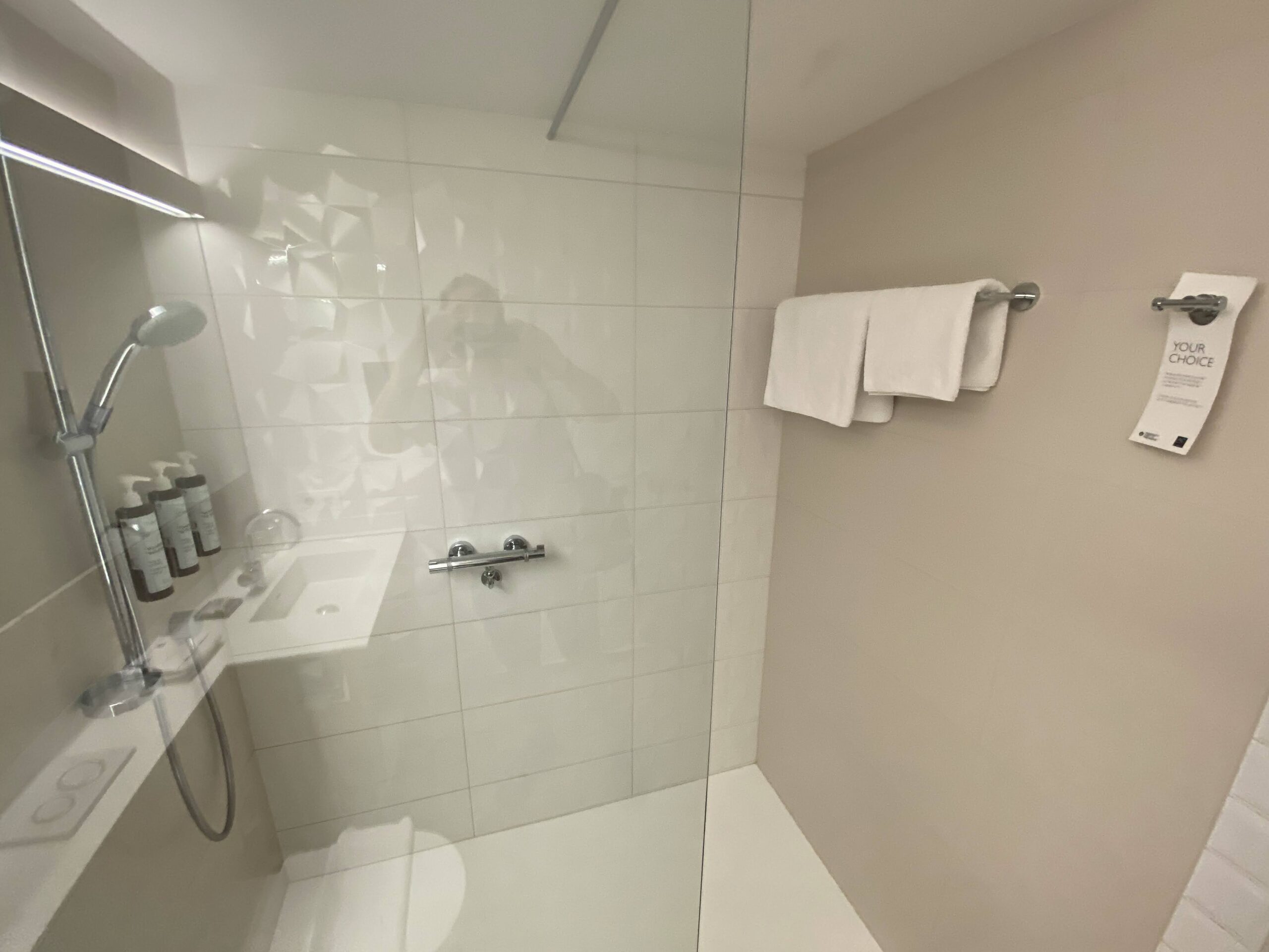 a bathroom with a glass shower